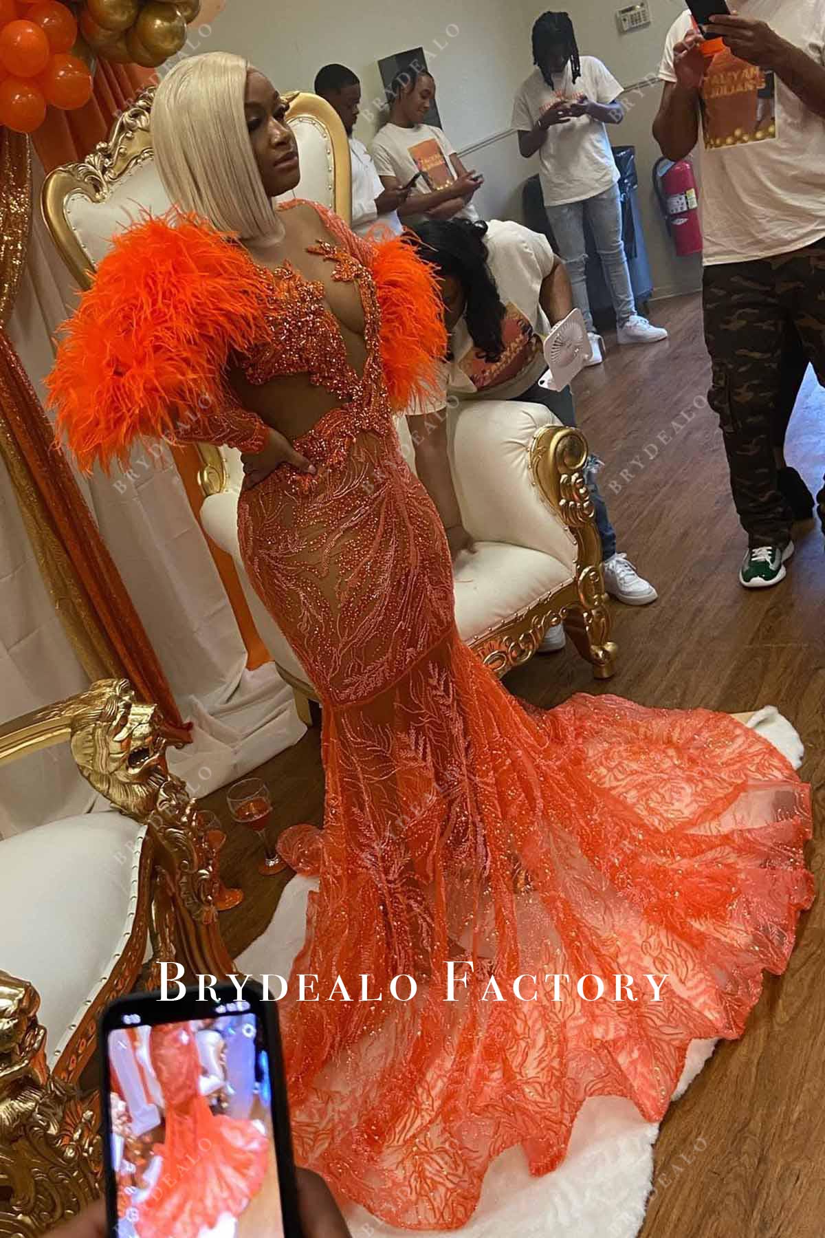orange feathered trumpet prom dress