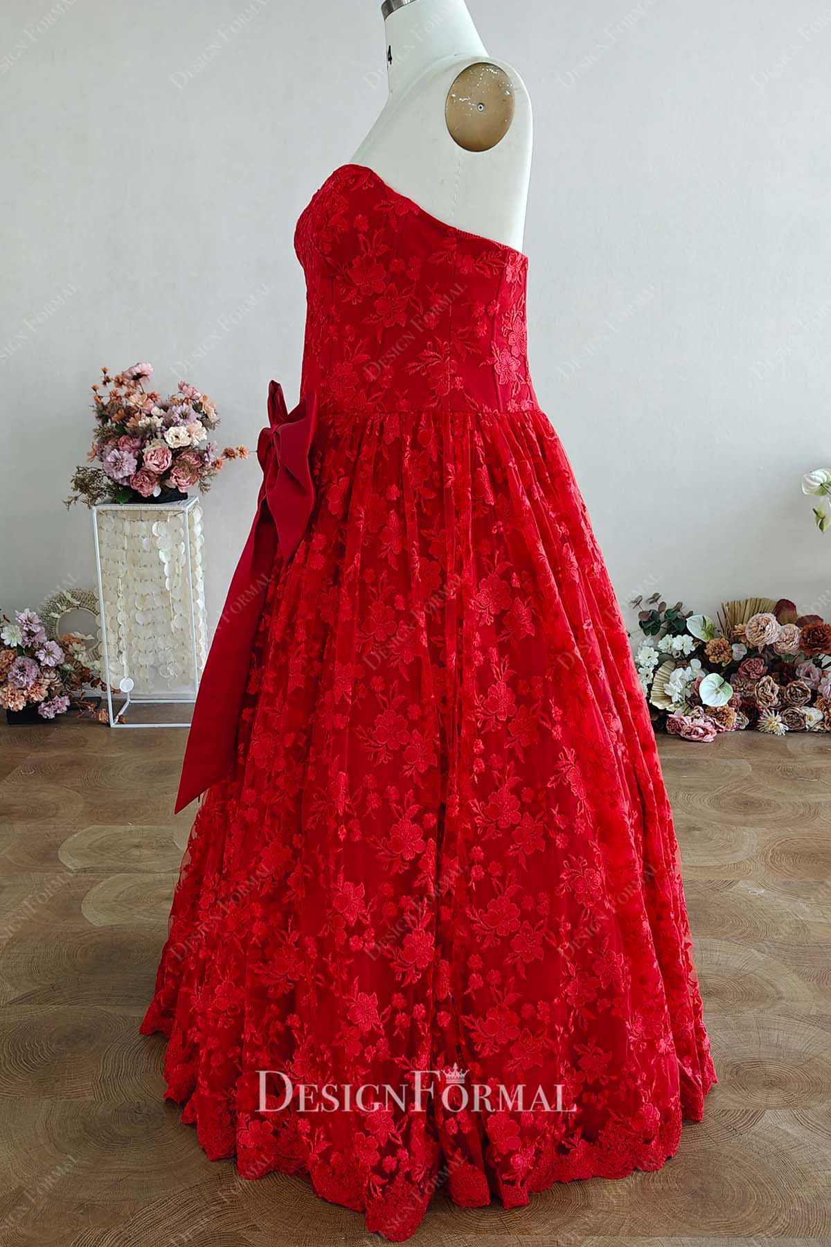 red lace strapless floor length ballgown