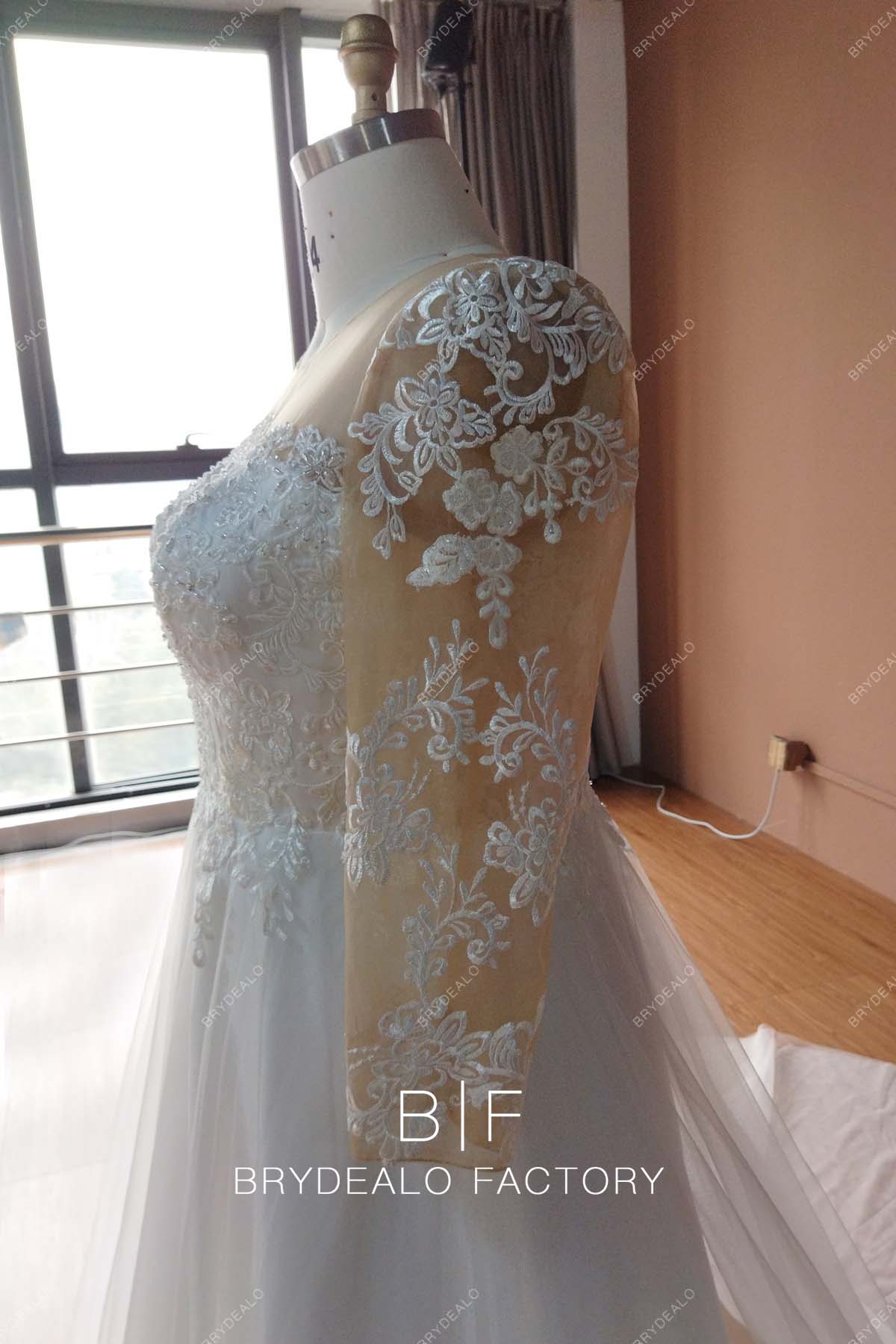 sheer long sleeves designer lace bridal gown