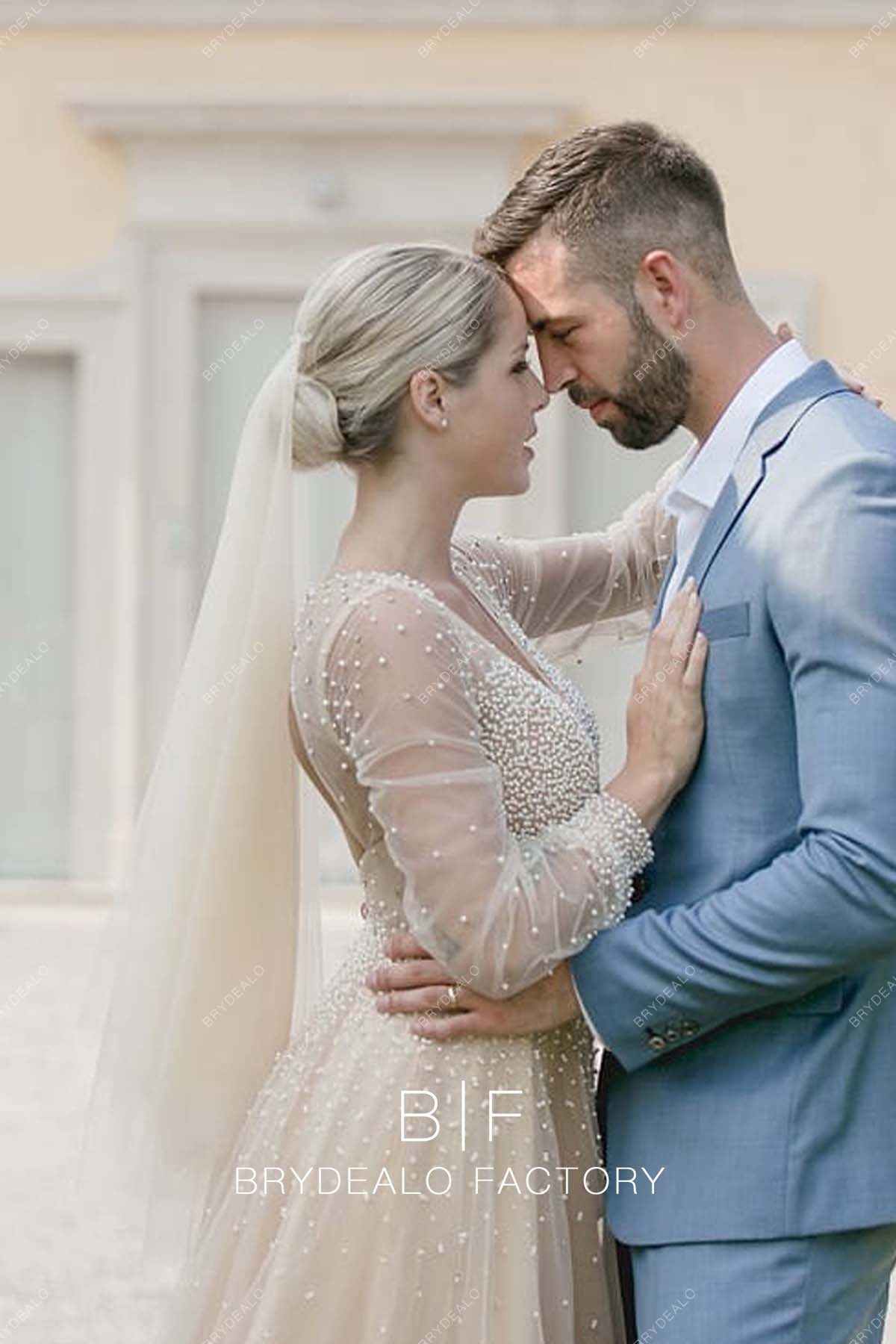 sheer long sleeves champagne pearls bridal gown