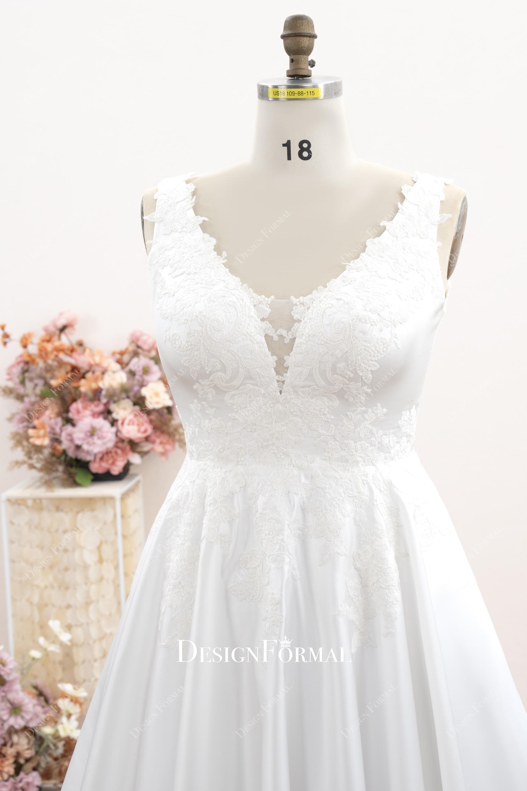sleeveless plunging neck lace wedding dress