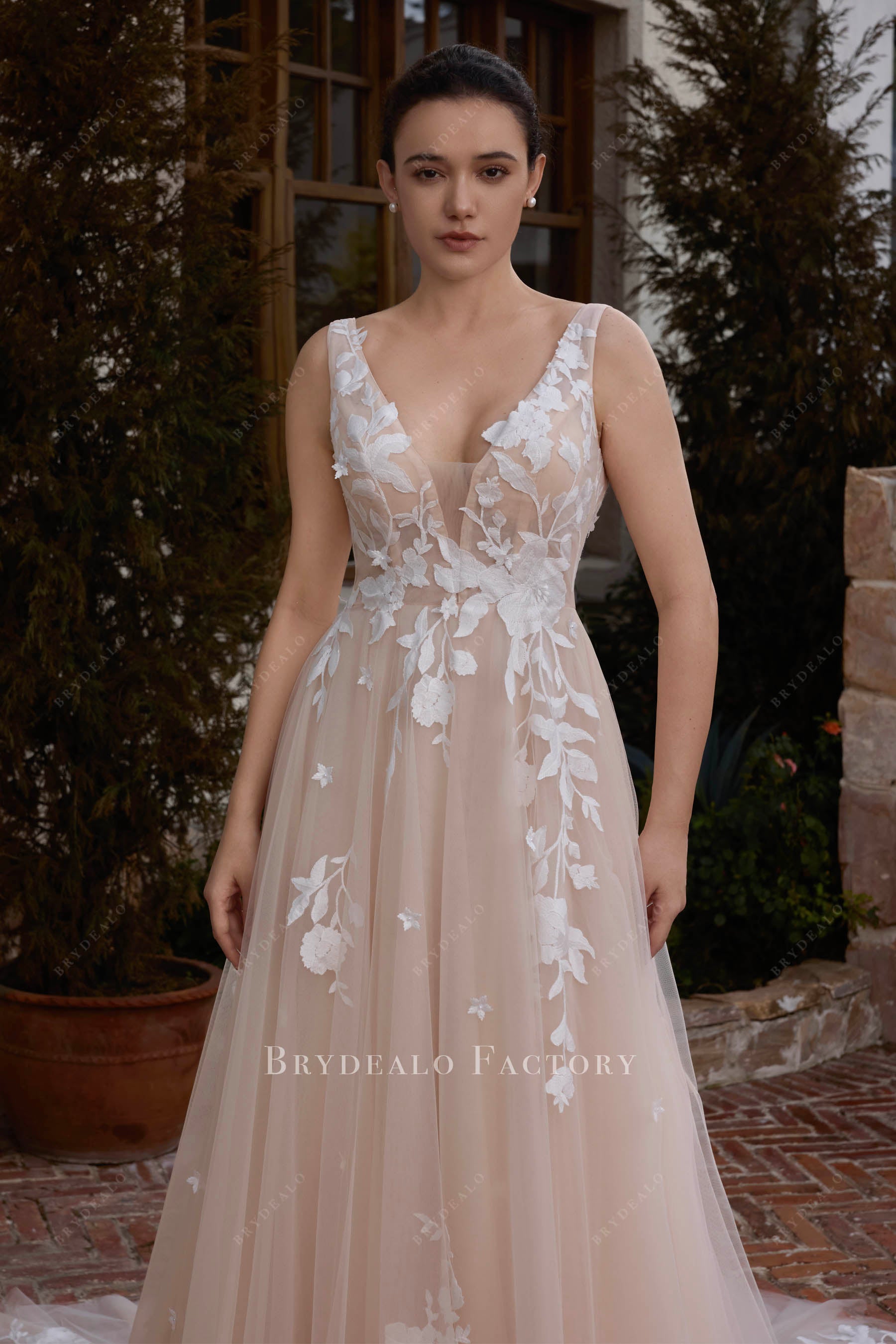 sleeveless plunging neck nude wedding dress