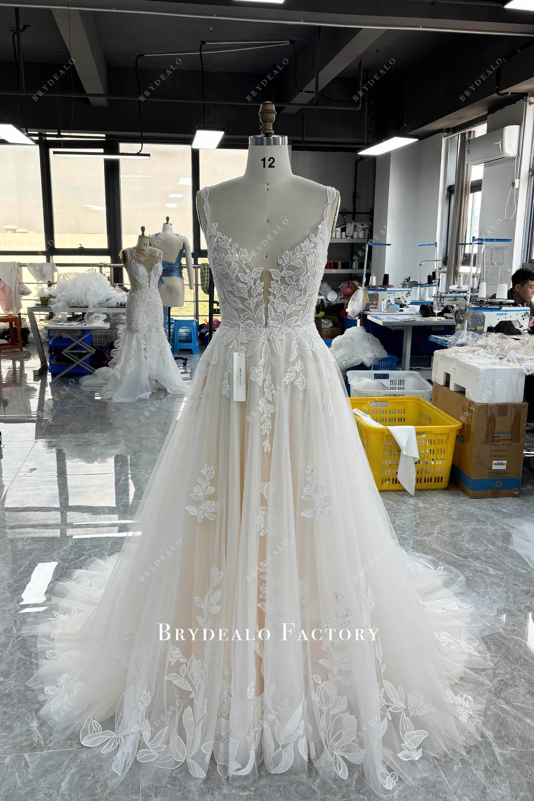 tailor made shimmery lace wedding dress