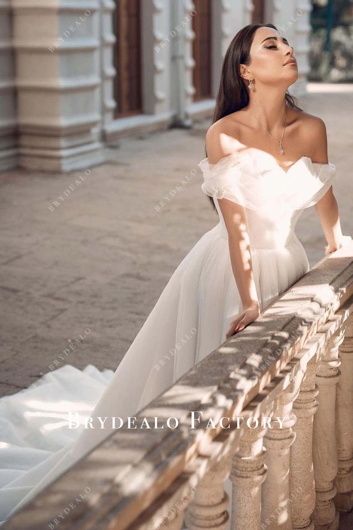 white pleated tulle bridal dress