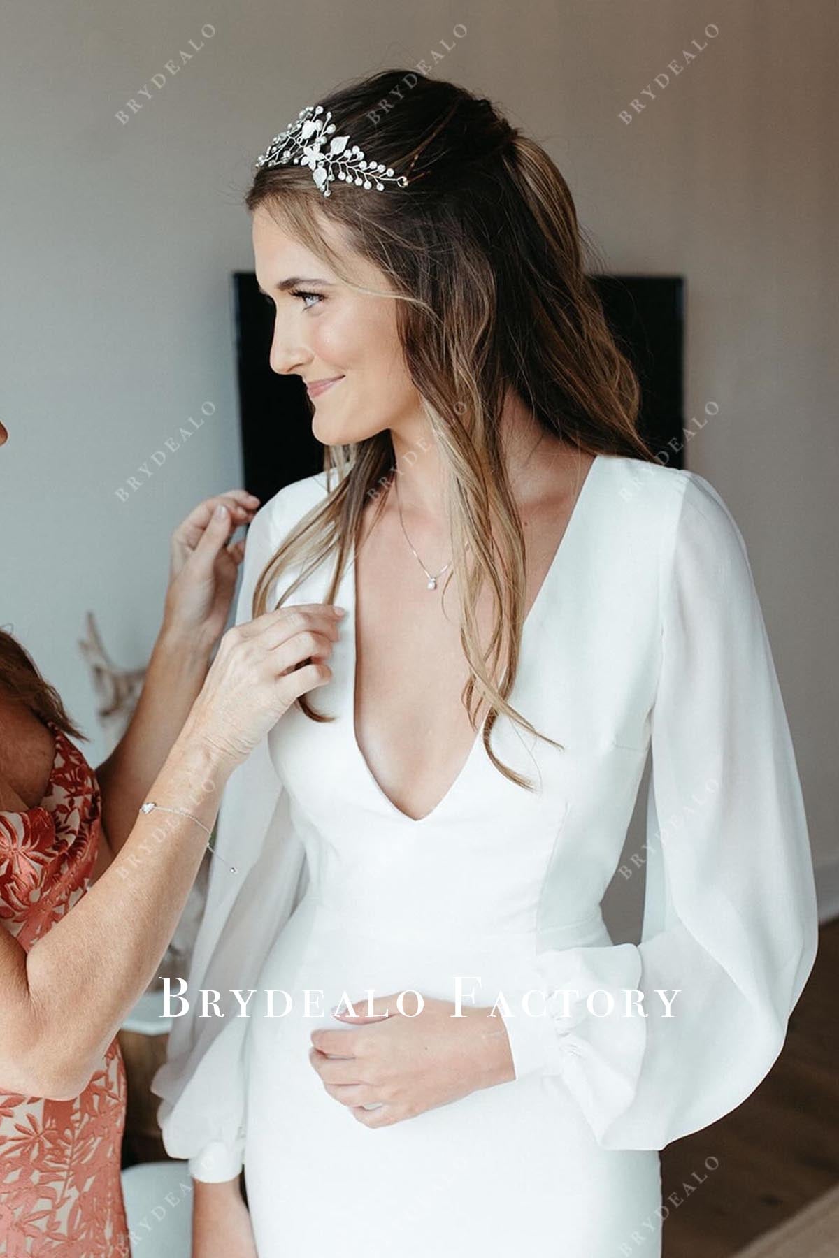 white plunging neck wedding dress