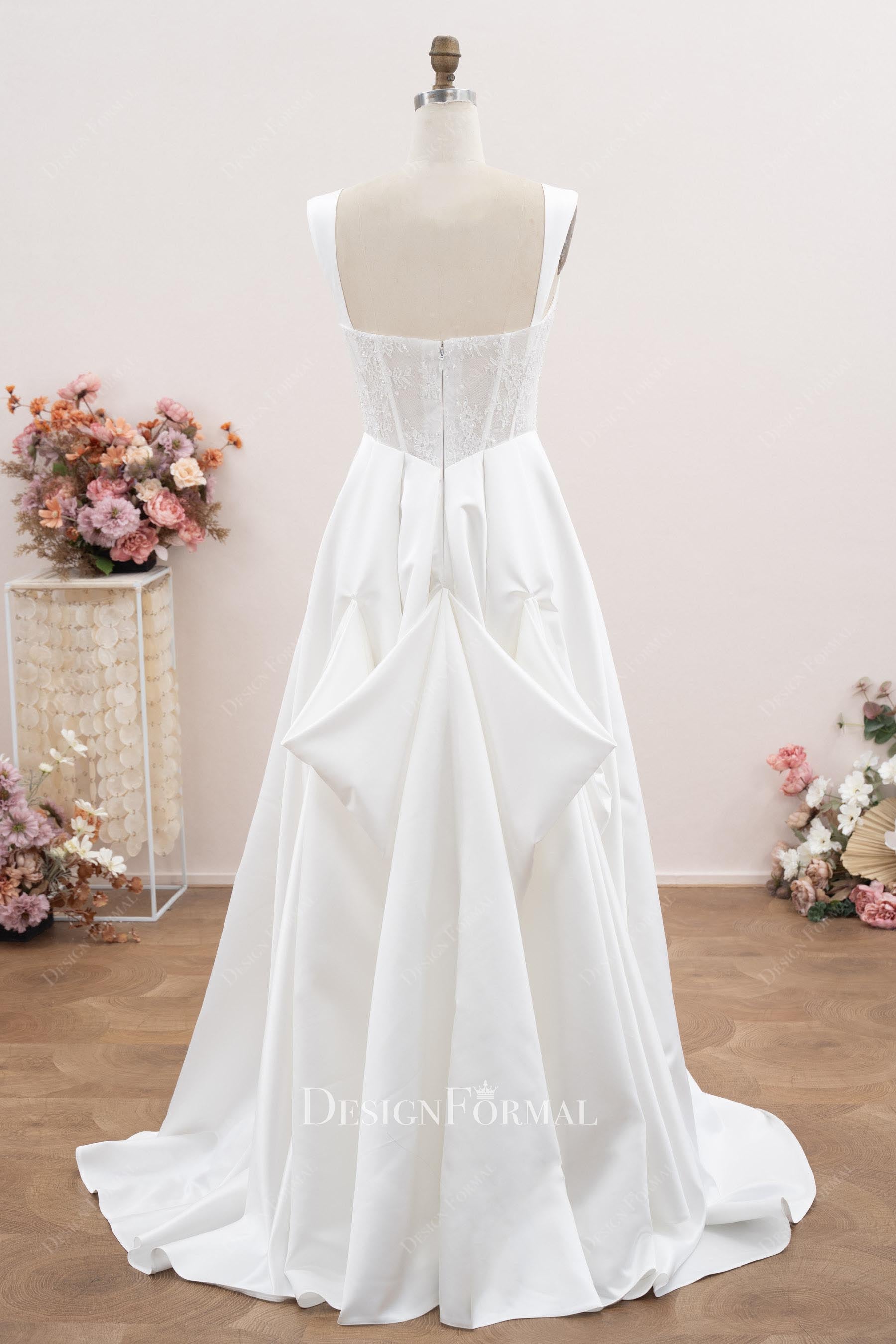 white satin bustled up wedding dress