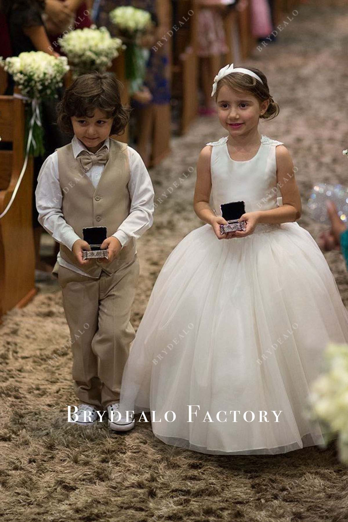 white sleeveless flower girl ballgown