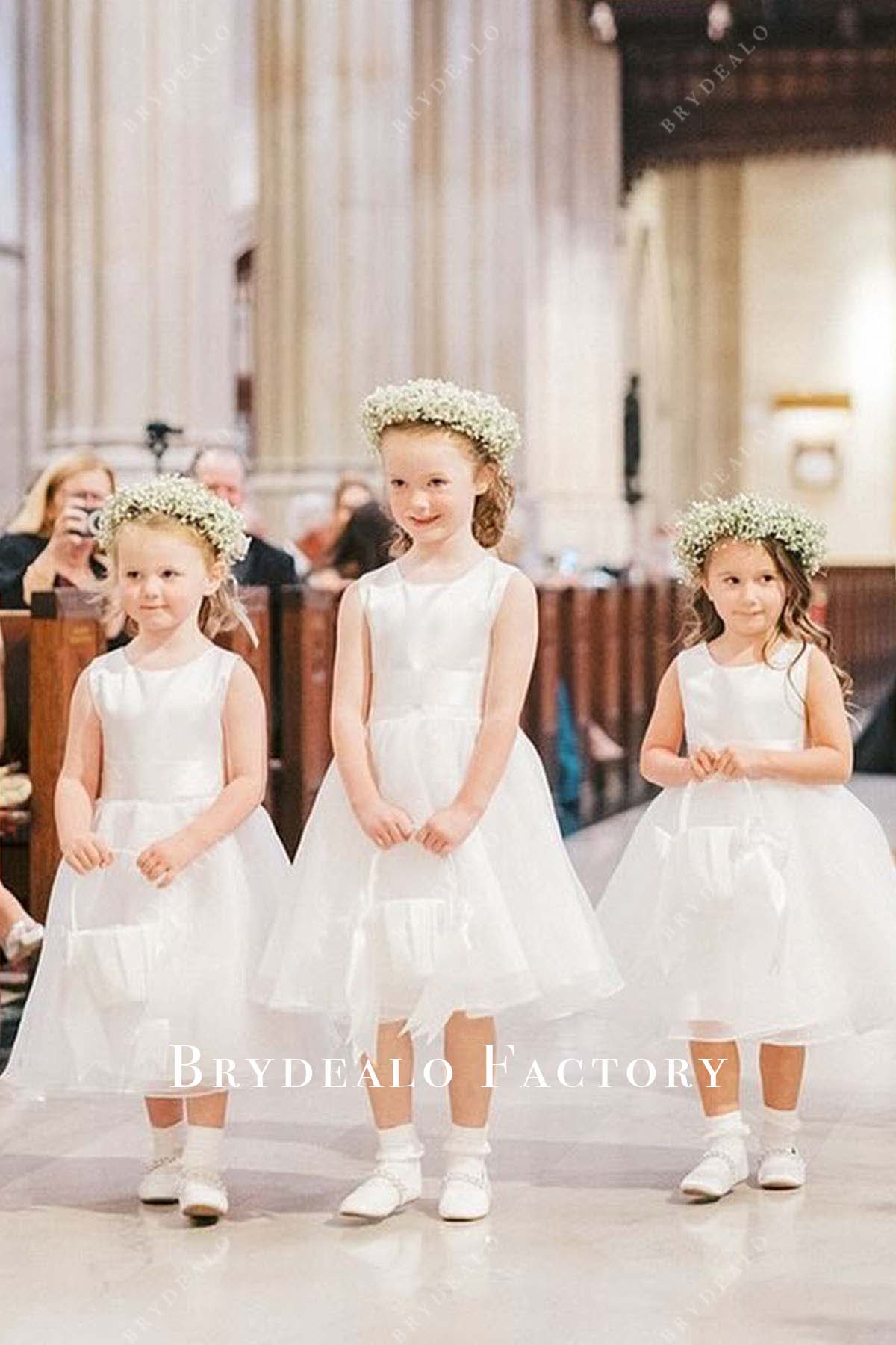 white sleeveless knee length flower girl dress