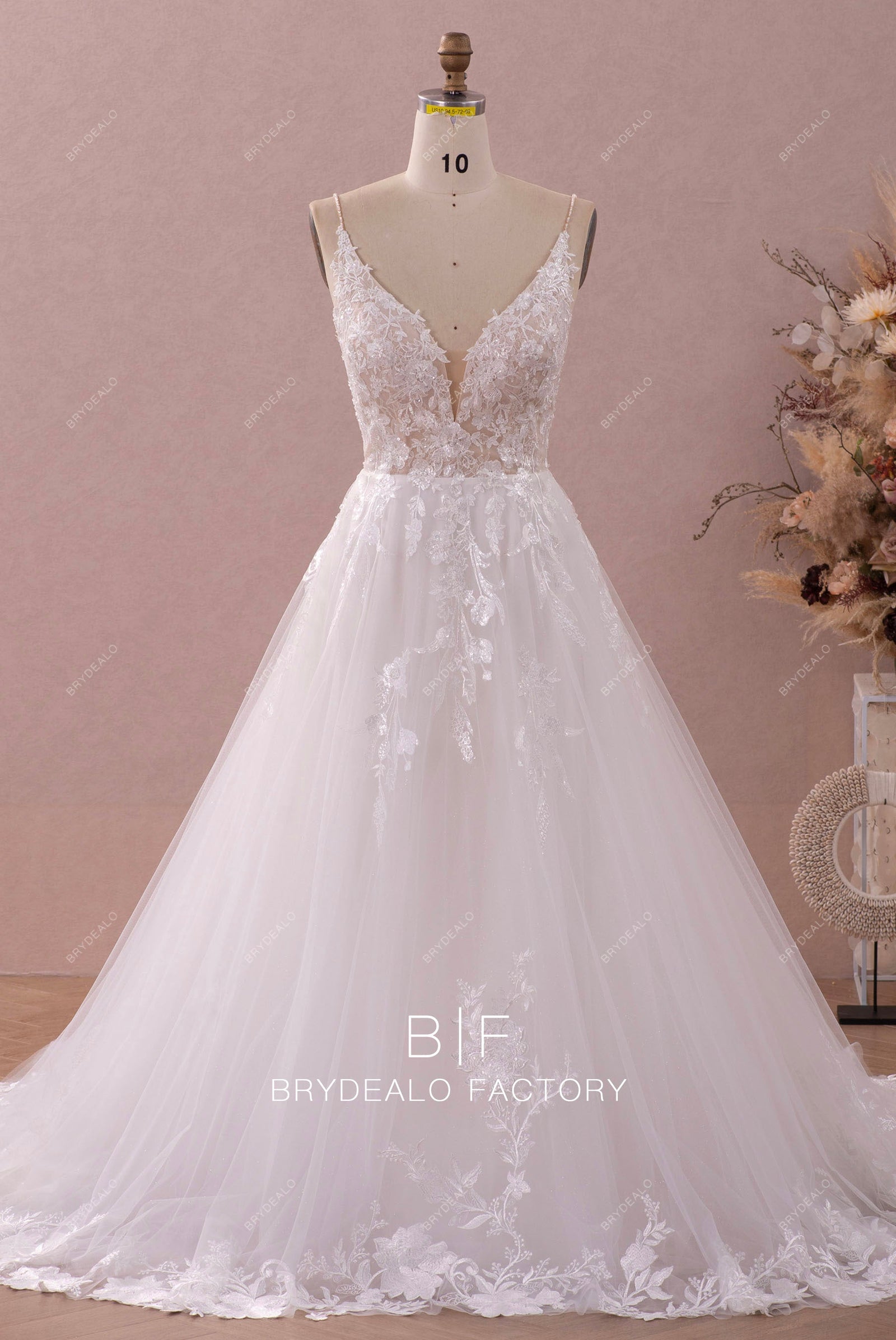 Elegant A-Line Wedding Dress with Intricate Lace and Sparkling Beaded Details
