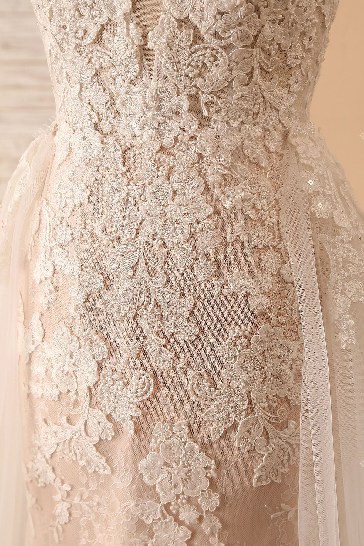 designer floral lace overlaid pearl pink colored wedding gown