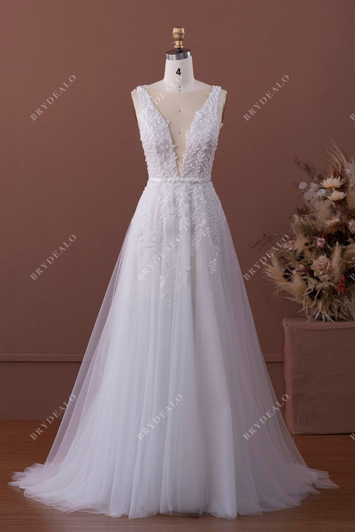 plunging neck designer lace bridal gown