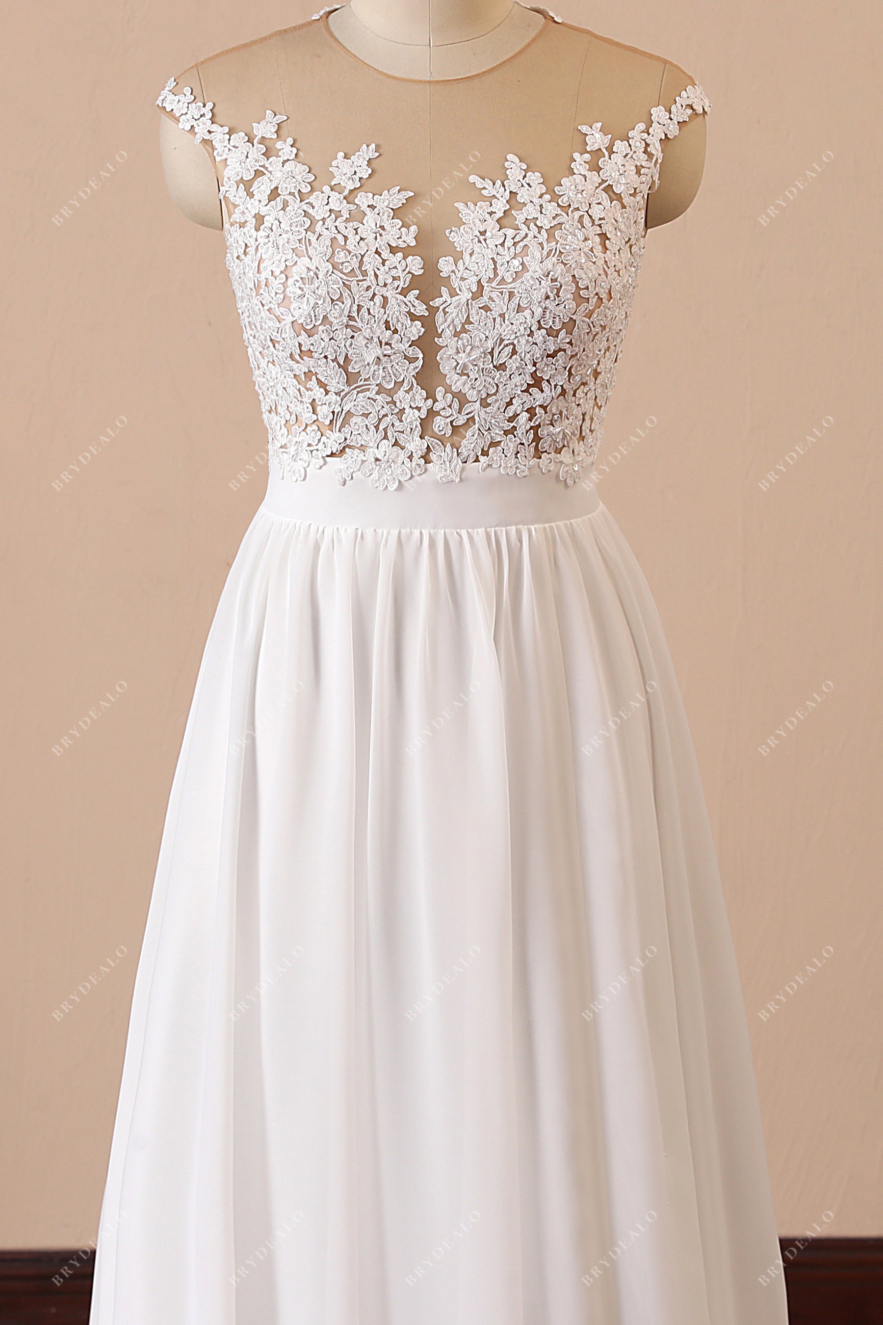 plunging neck sheer cap sleeve bridal gown