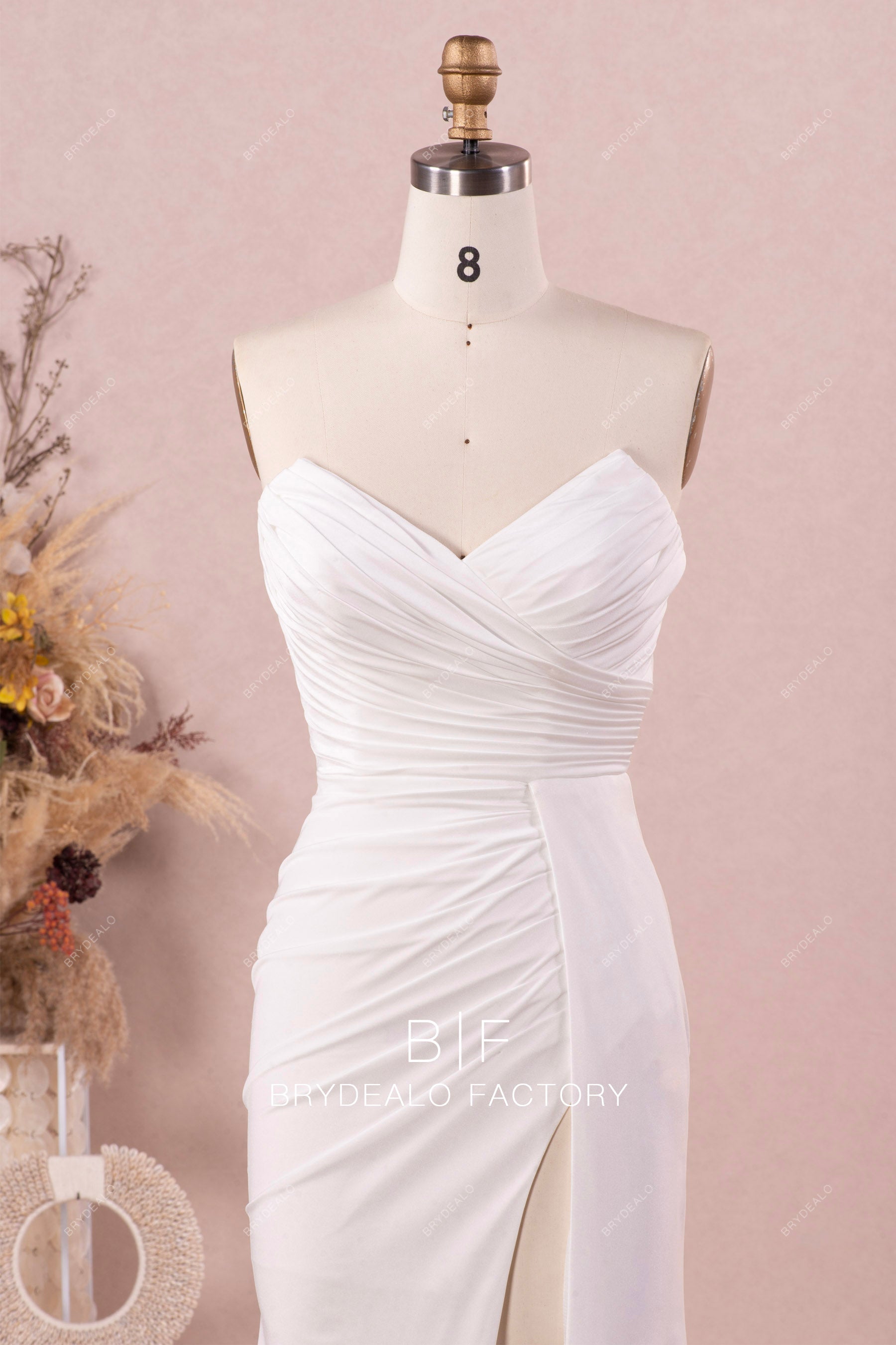 V-cut strapless pleated jersey wedding dress