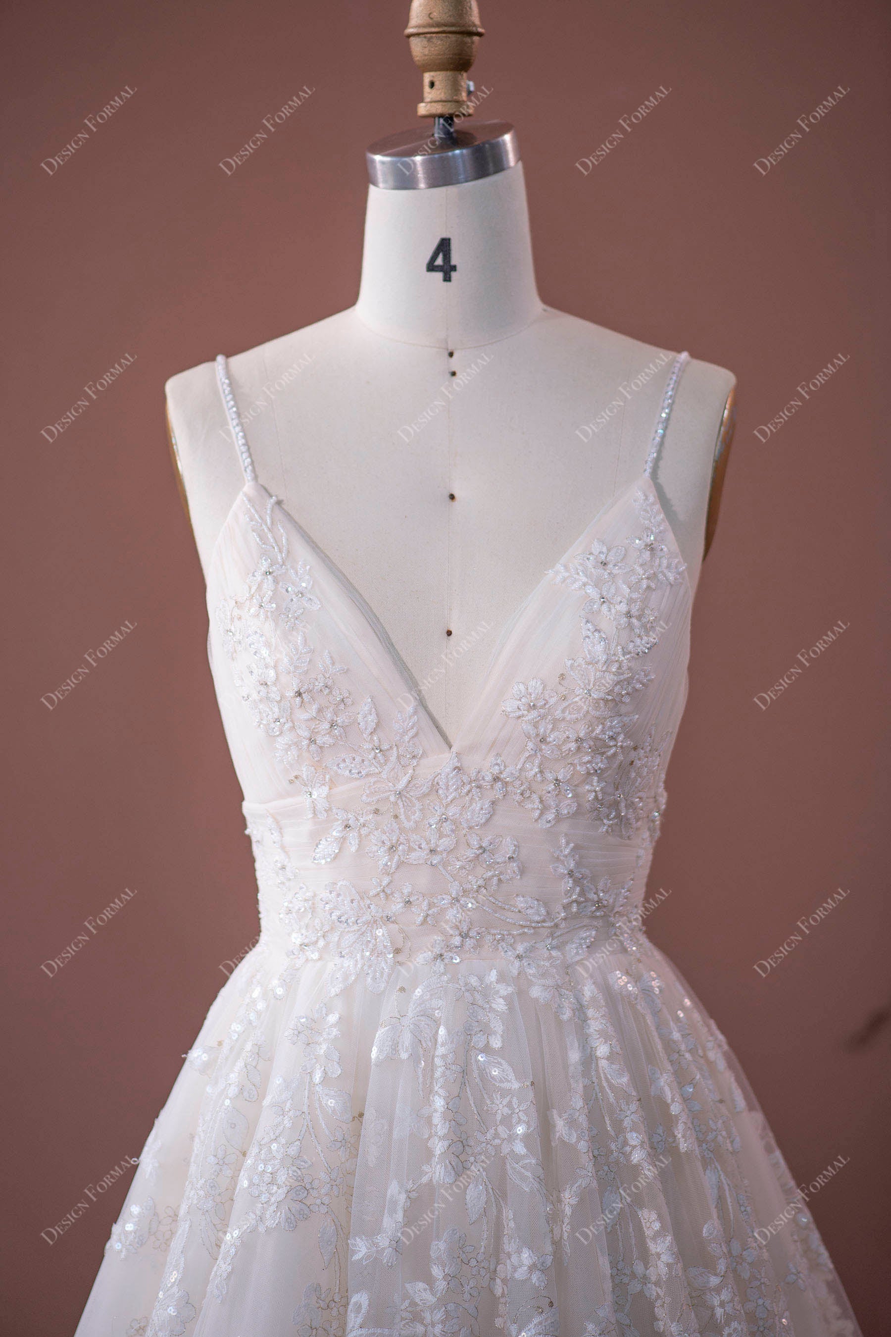 beaded lace appliqued bodice with plunging neck 