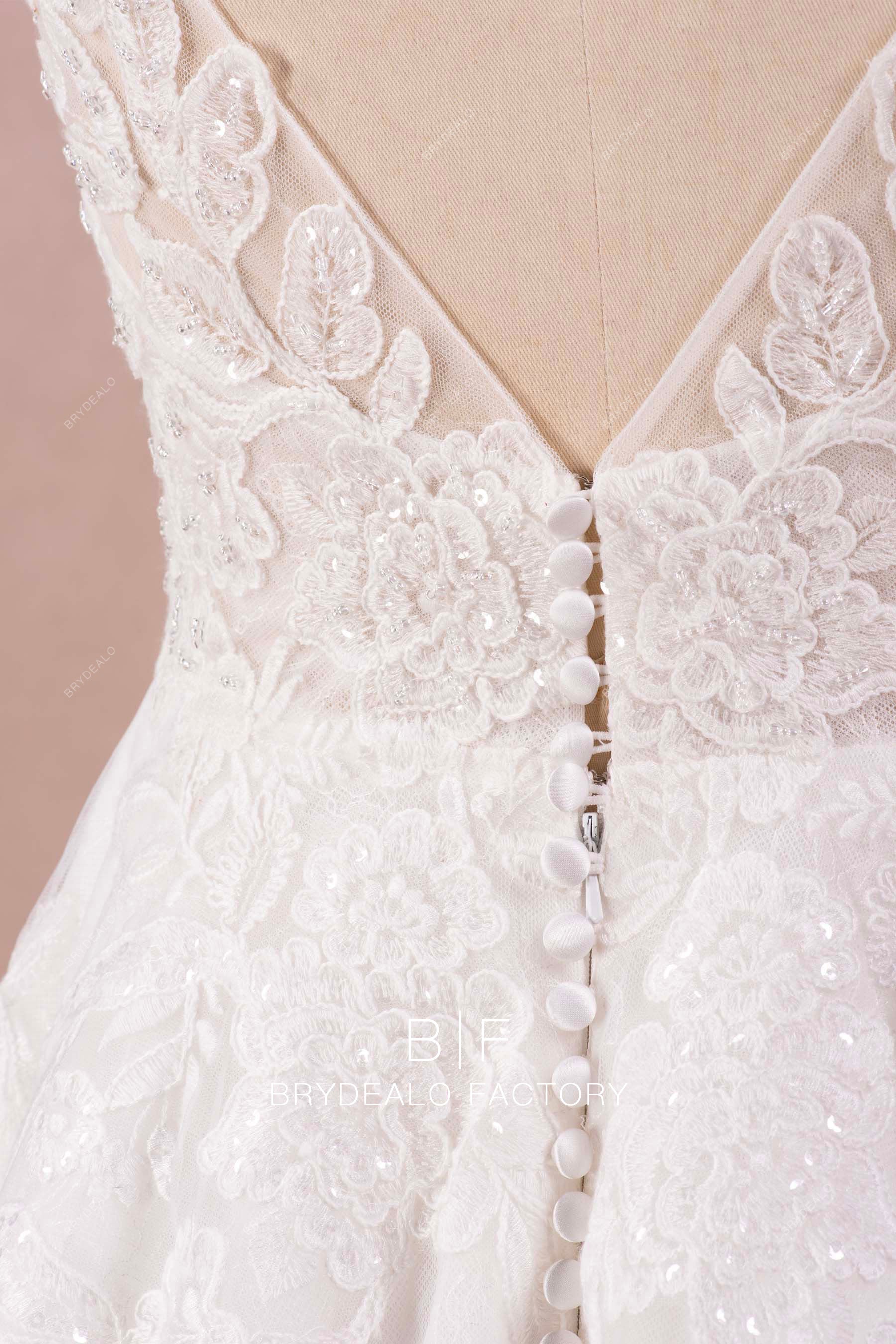 buttoned V-back lace wedding gown