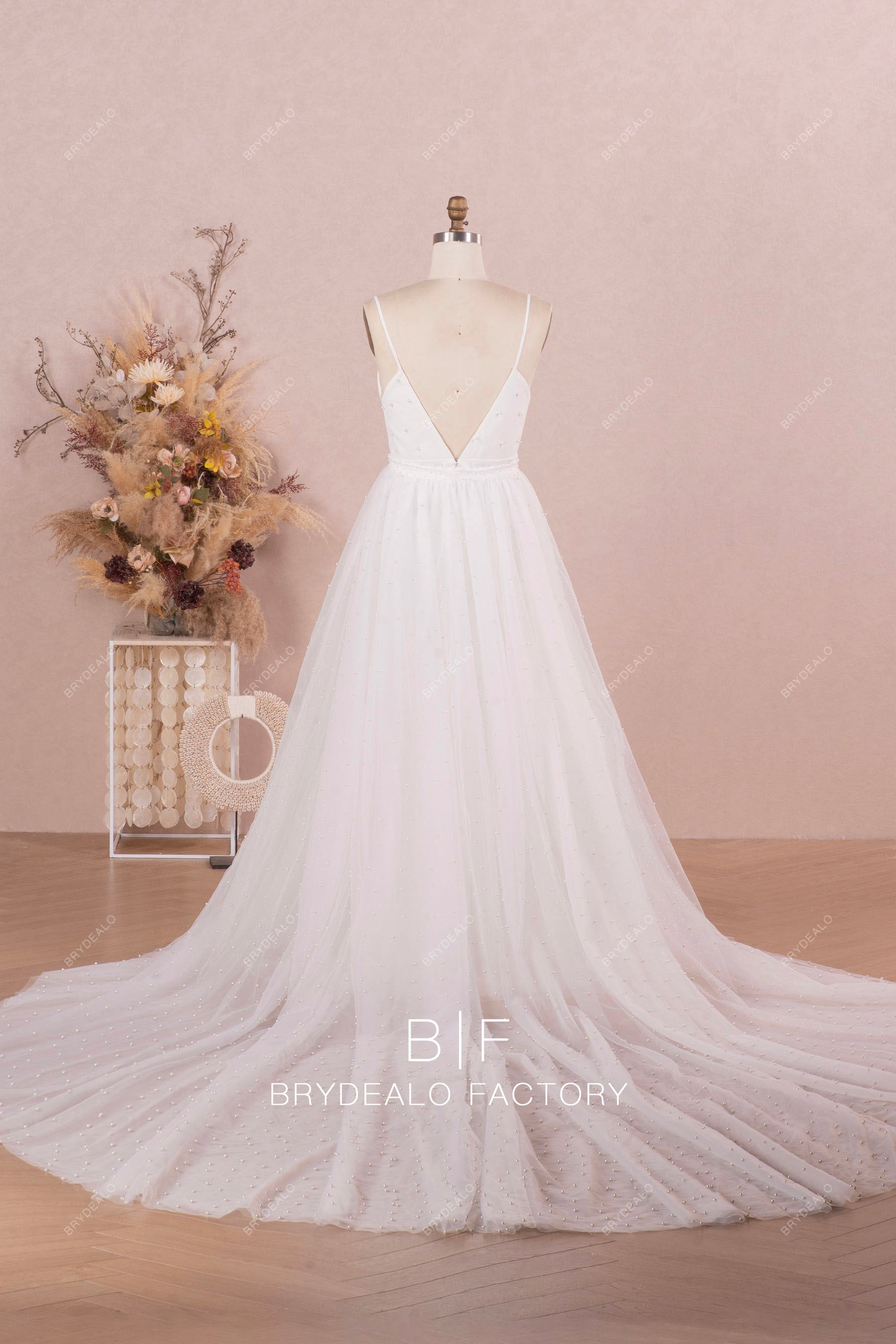 designer cathedral length pearl overskirt wedding dress