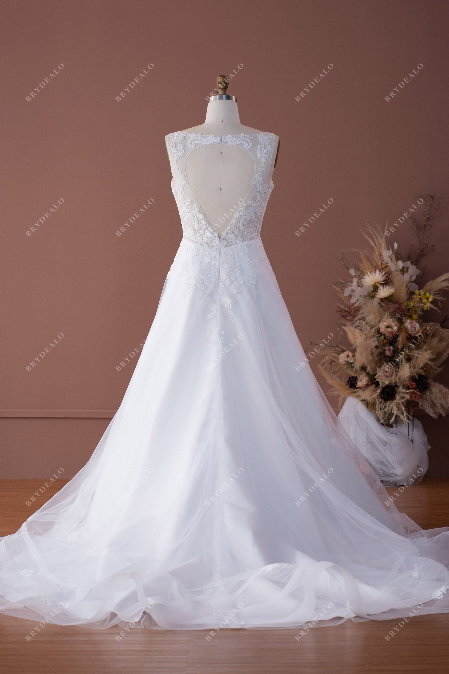 keyhole back A-line designer lace bridal gown