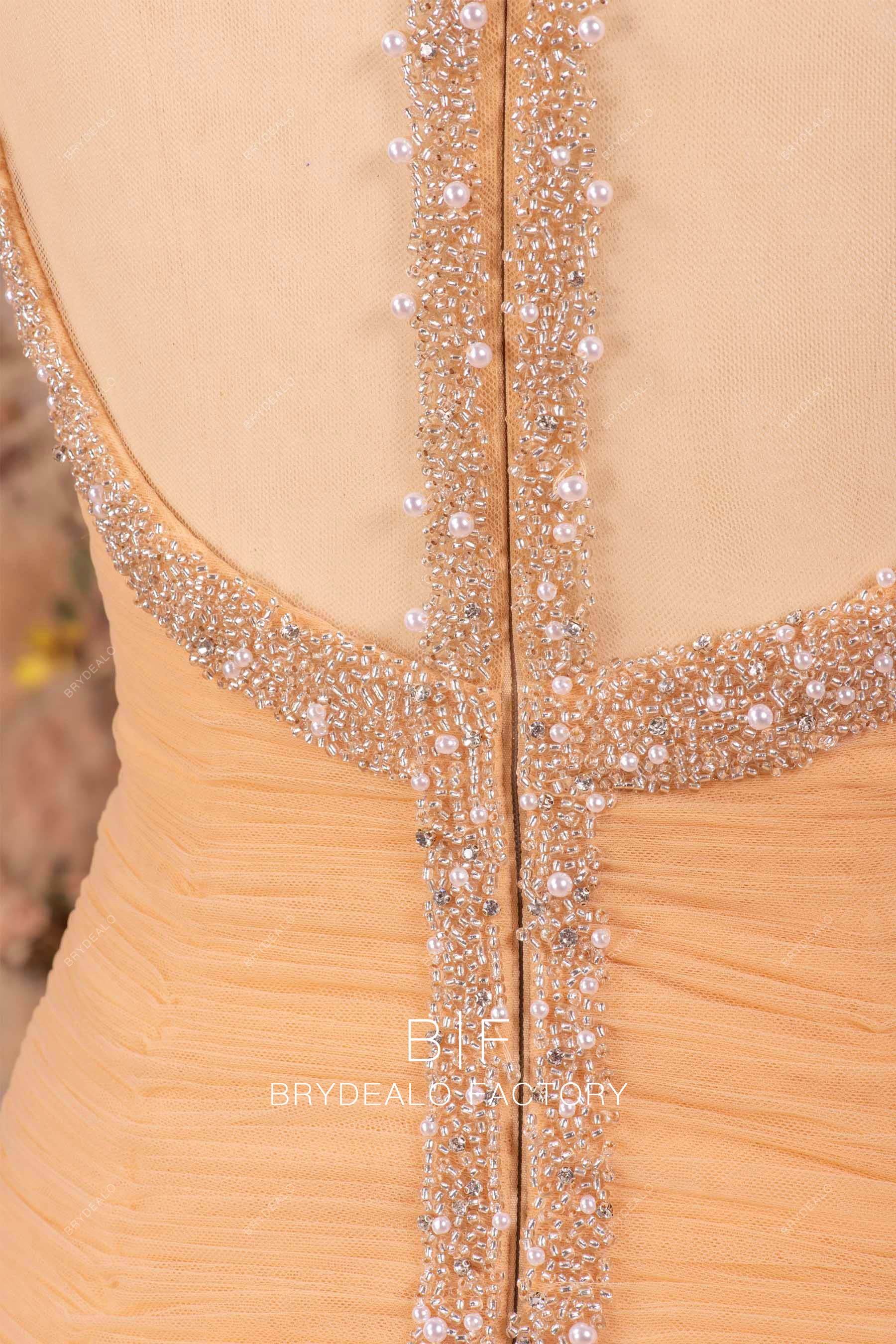 hand-sewn beaded illusion back gold wedding gown