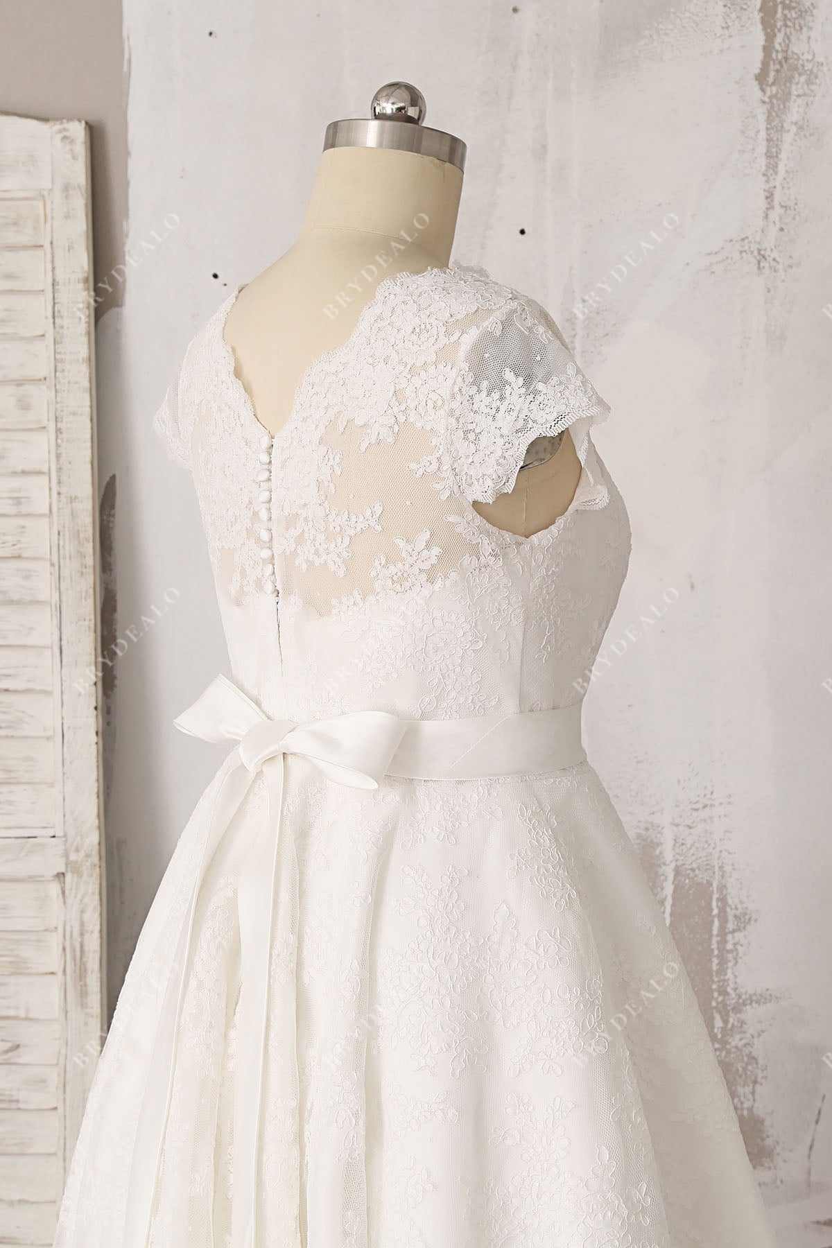 informal lace V-back cap sleeve bridal dress