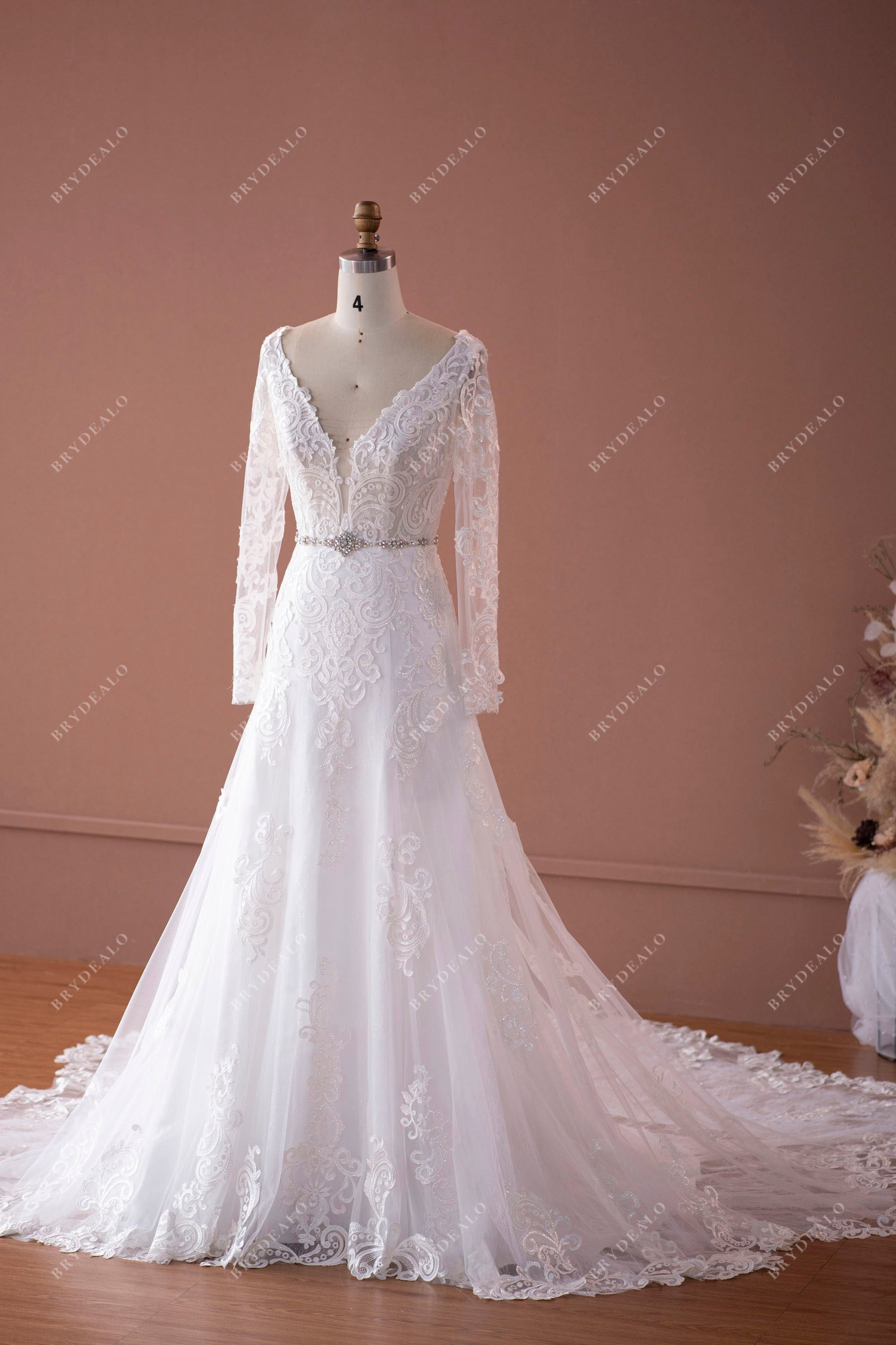 sheer sleeves fit and flare bridal gown