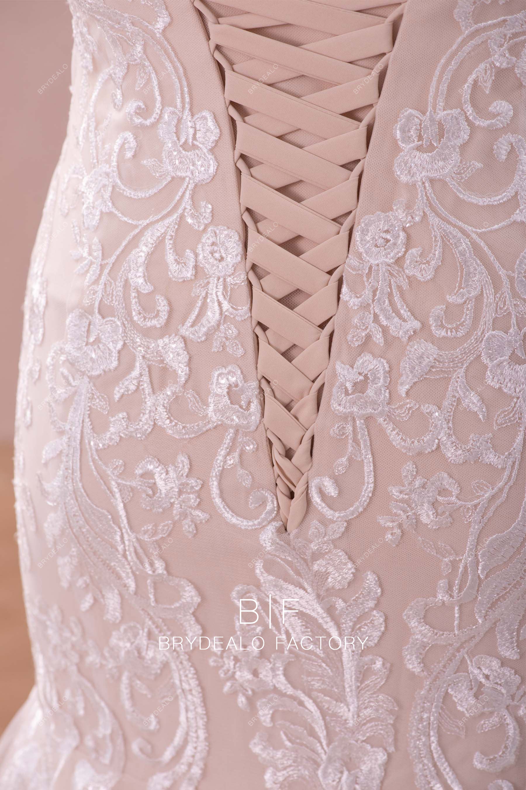 ivory lace overlaid nude pink trendy bridal gown