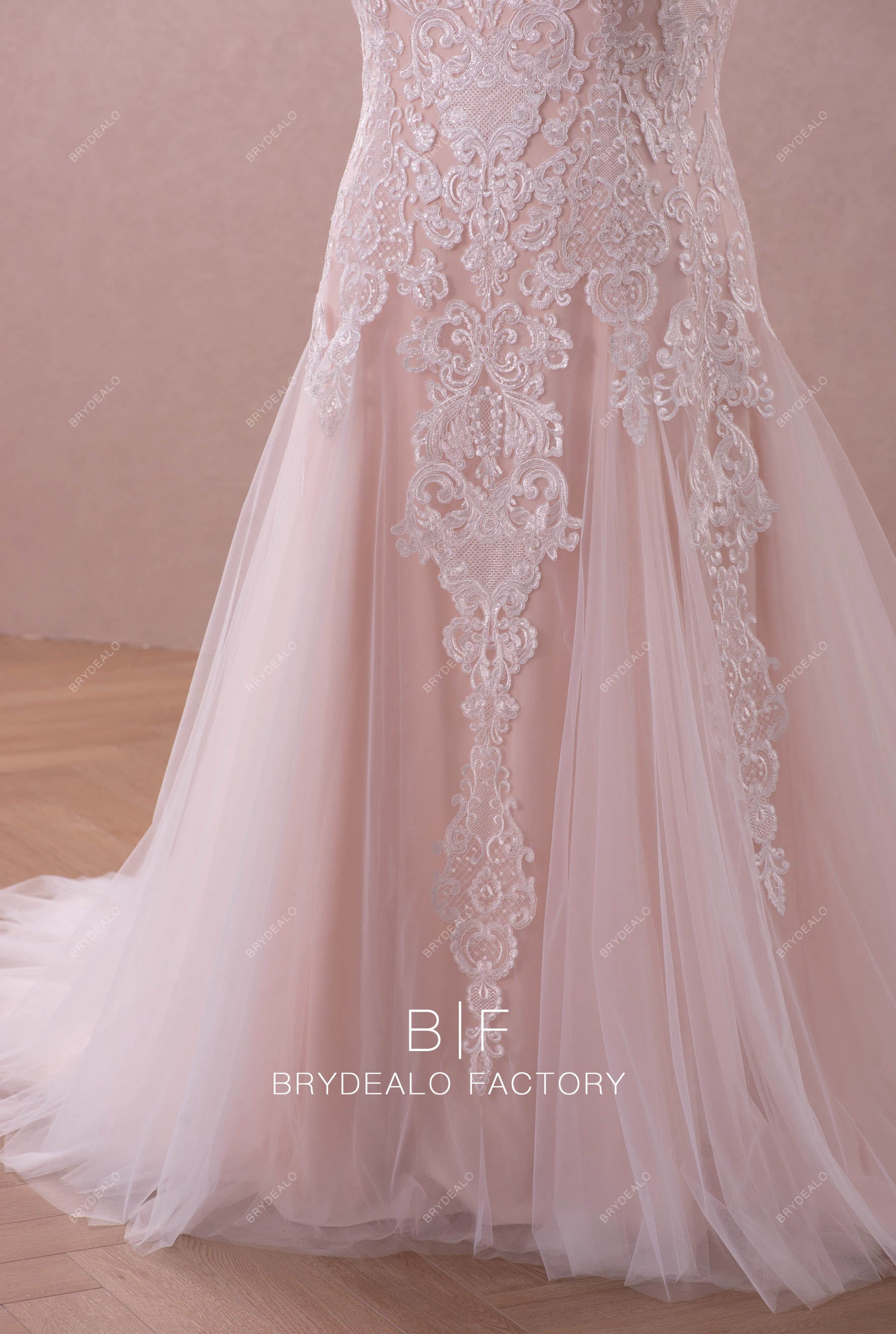 nude pink colored fit and flare wedding gown