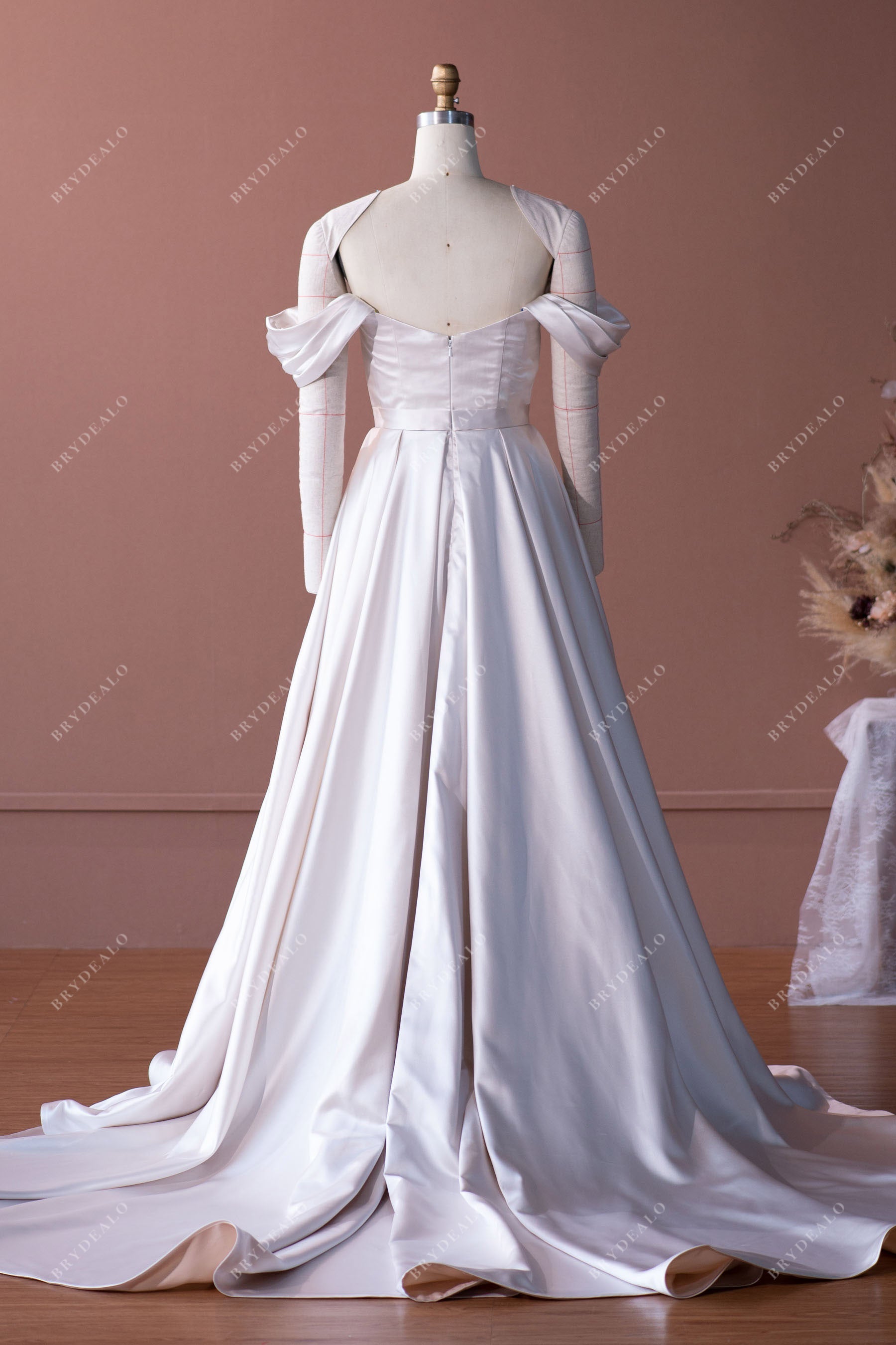 ruffled long train designer satin A-line bridal gown