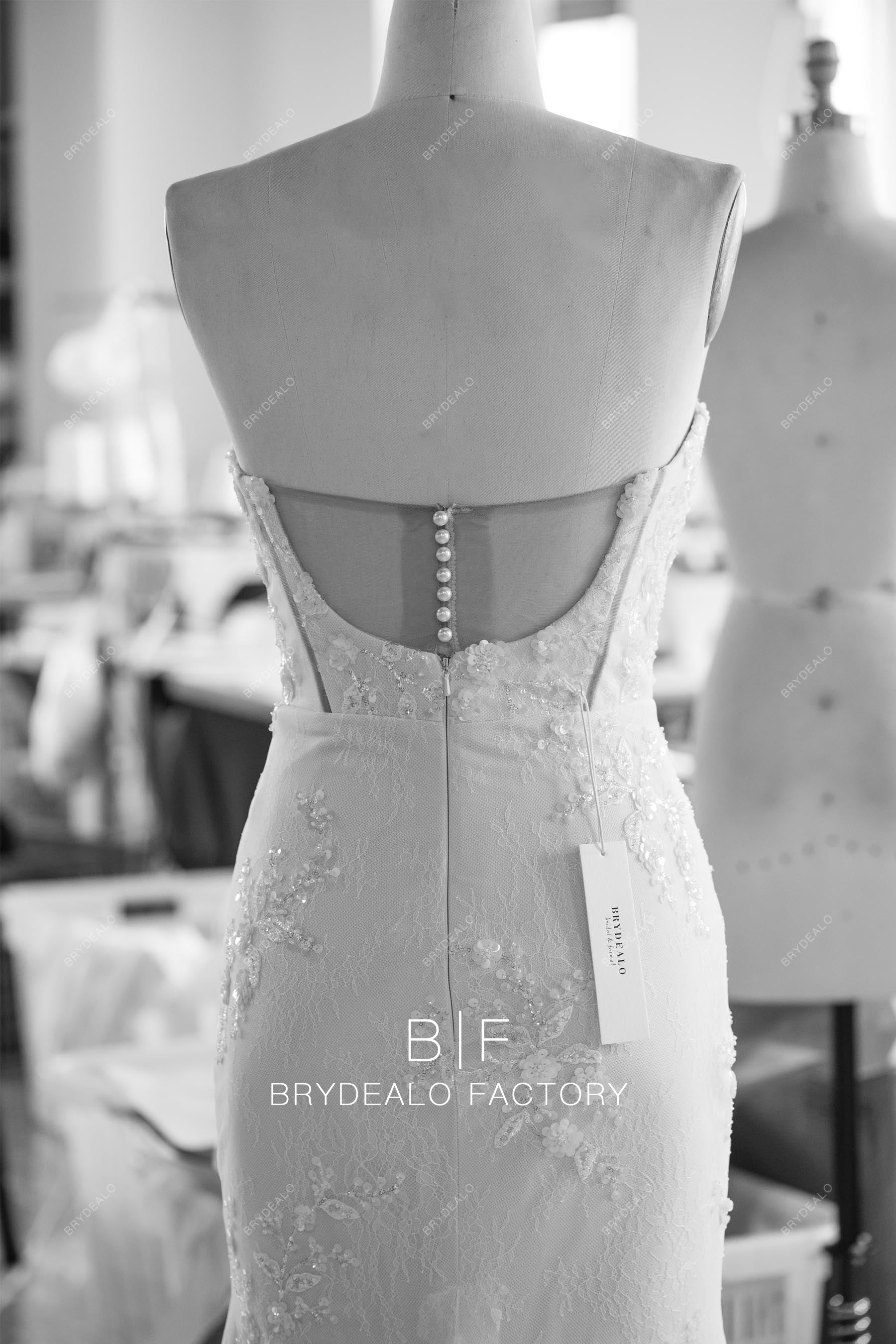 custom pearl buttoned illusion back bridal gown