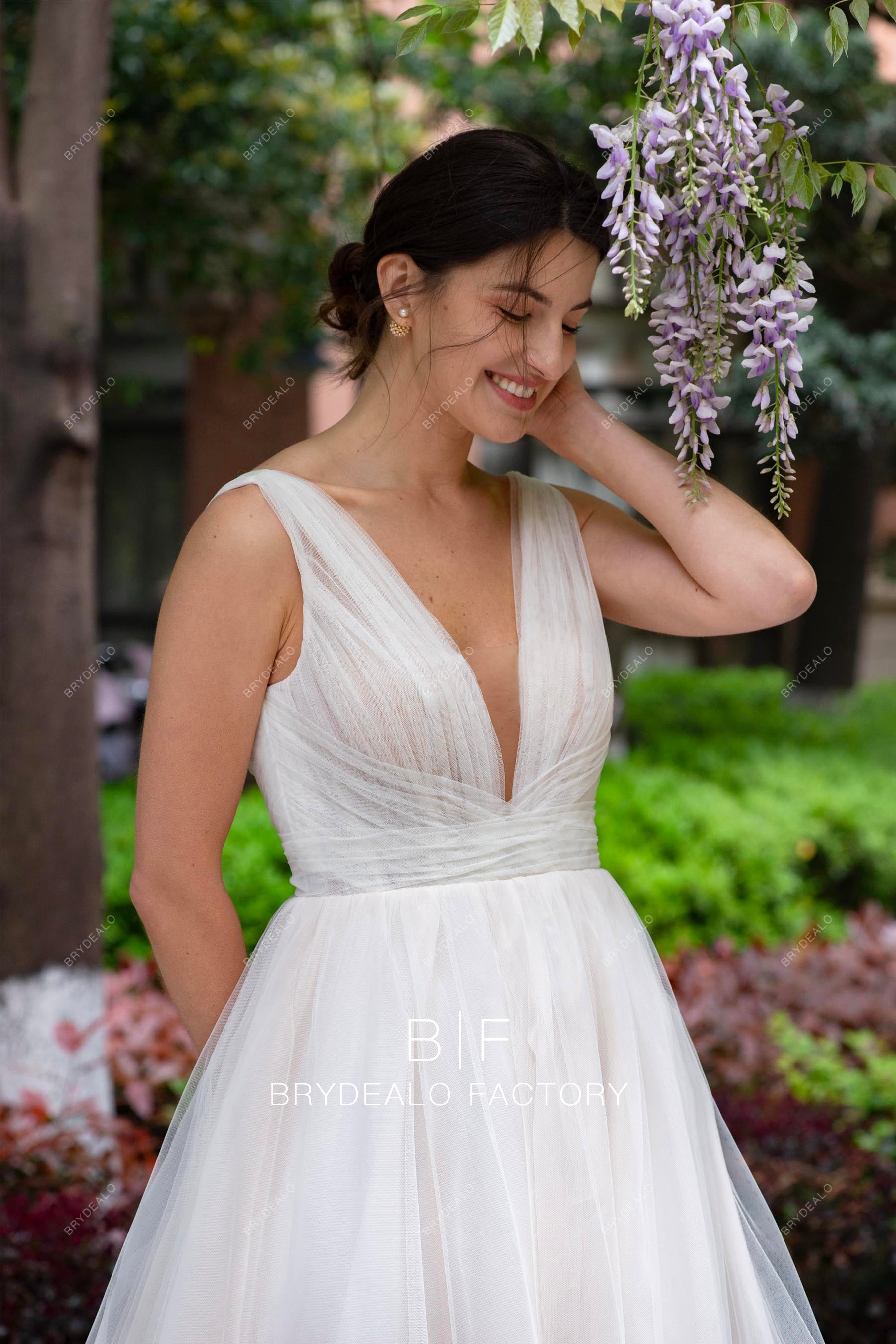 sleeveless plunging tulle designer spring wedding dress