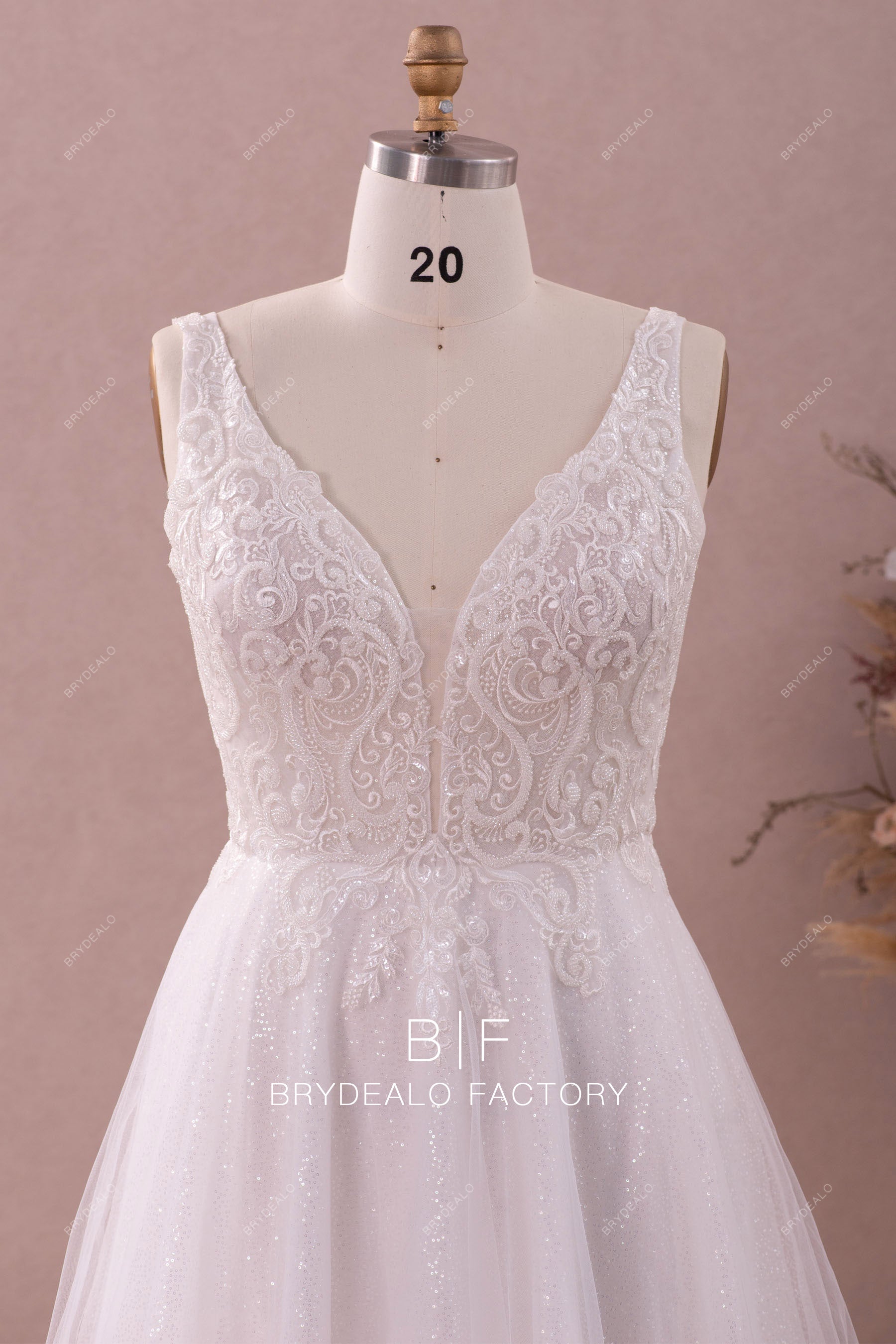 sleeveless beaded lace plunging plus size wedding dress