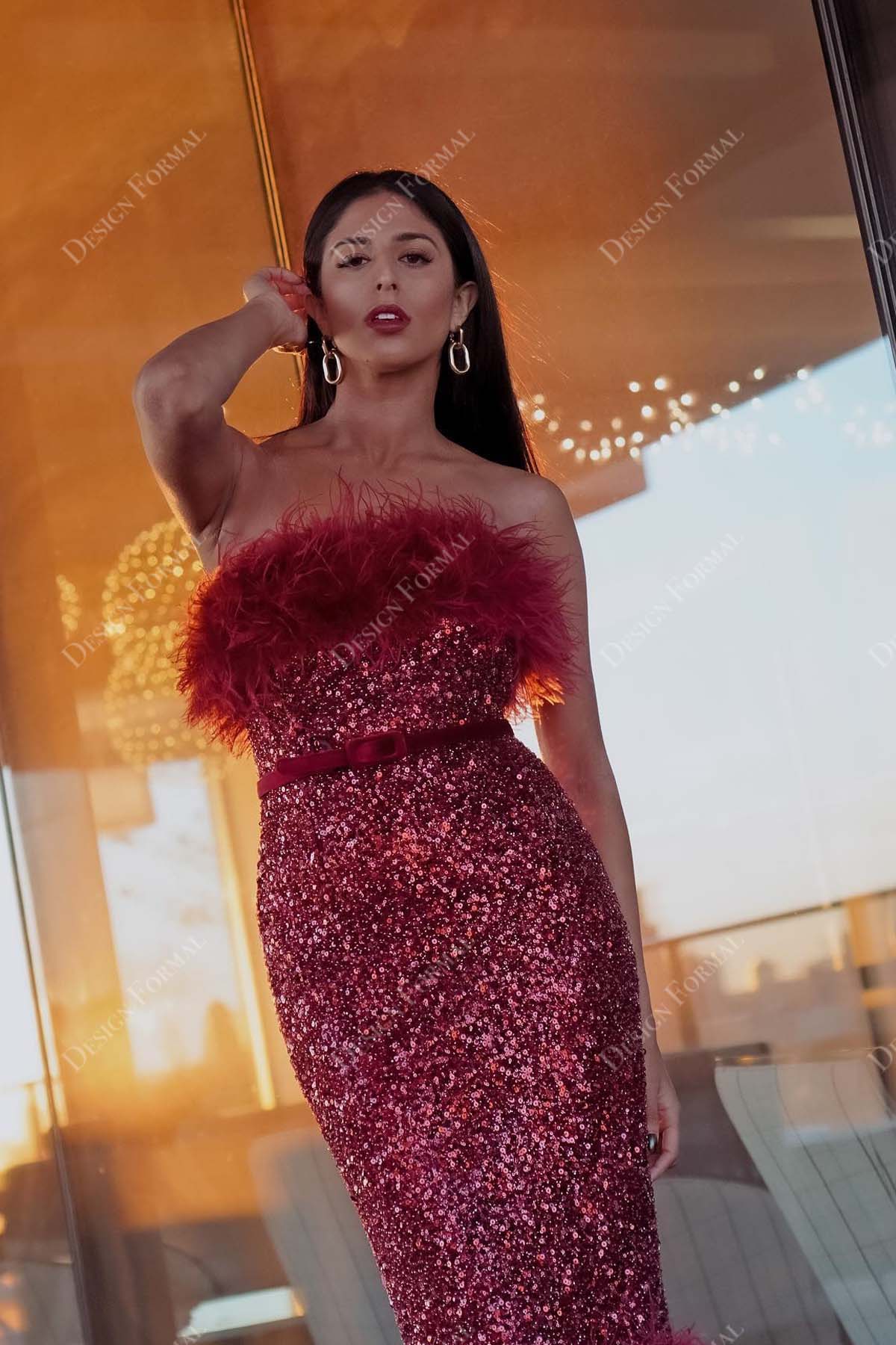 red sequin feather strapless straight across neck fishtail gown