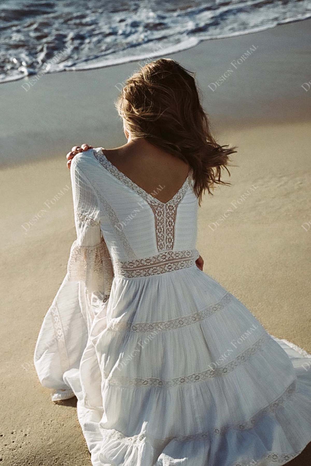 sheer V-back lace designer wedding gown