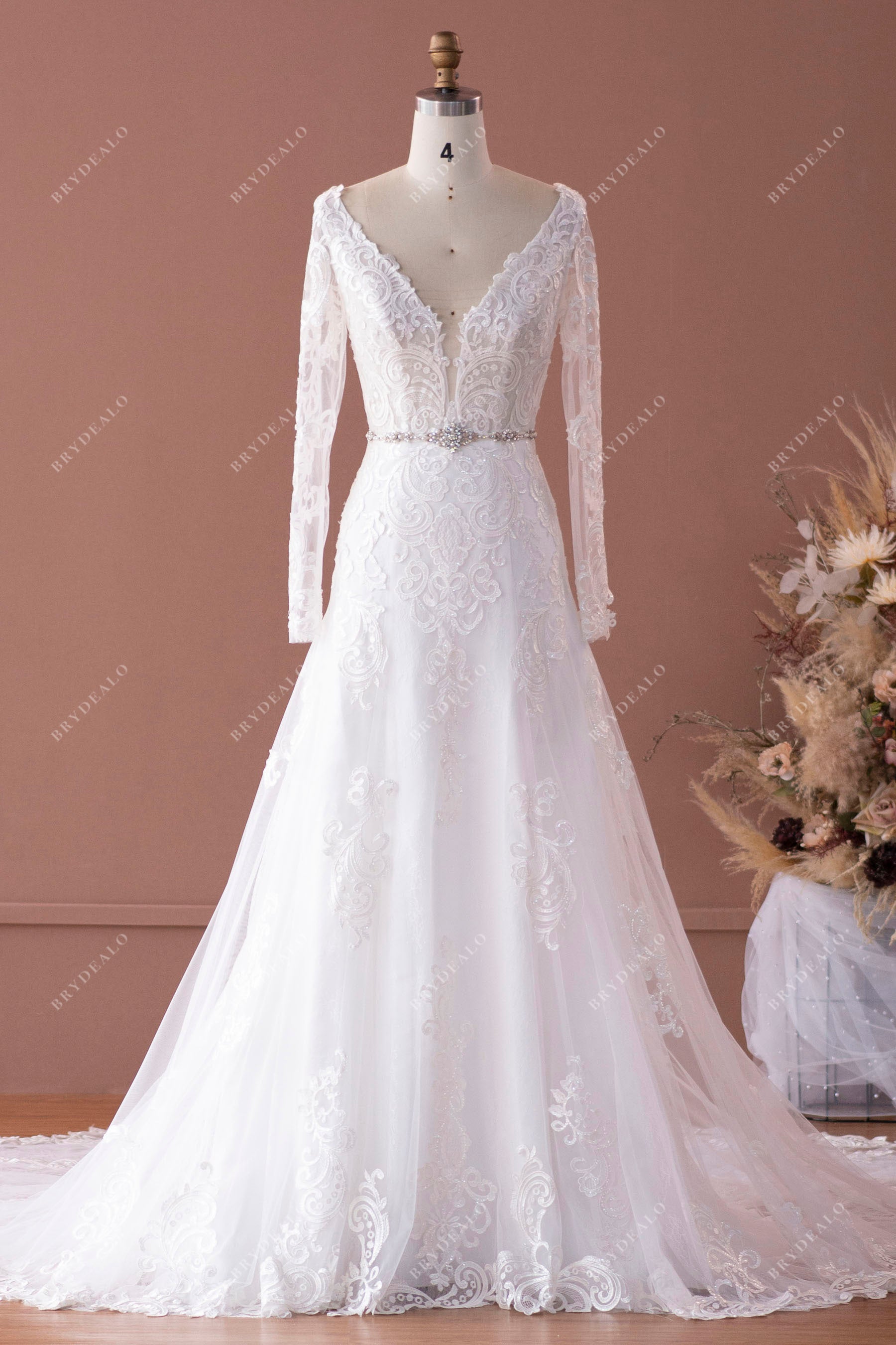 plunging neck sheer sleeves bridal gown