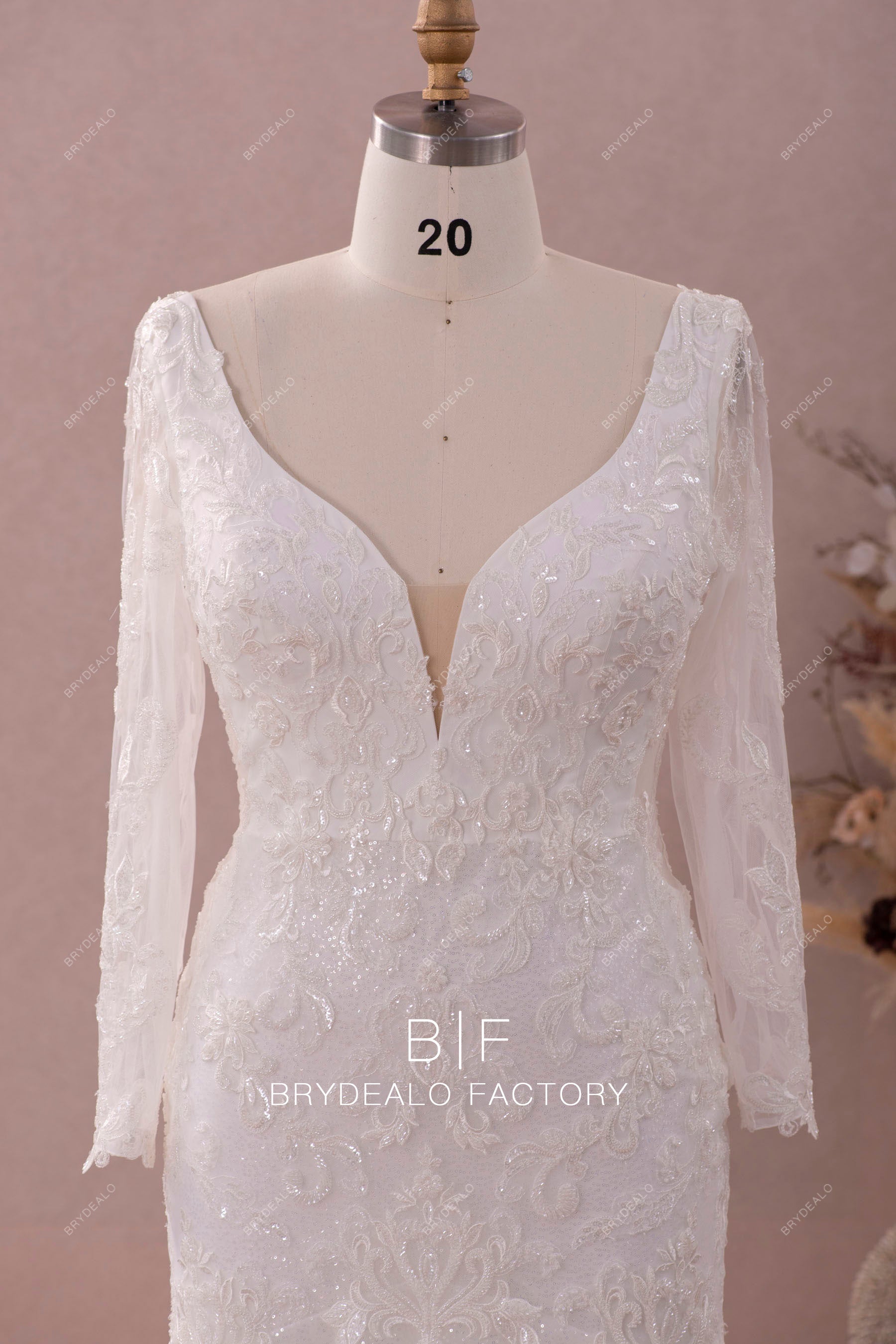 sheer sleeves plunging beaded lace wedding dress