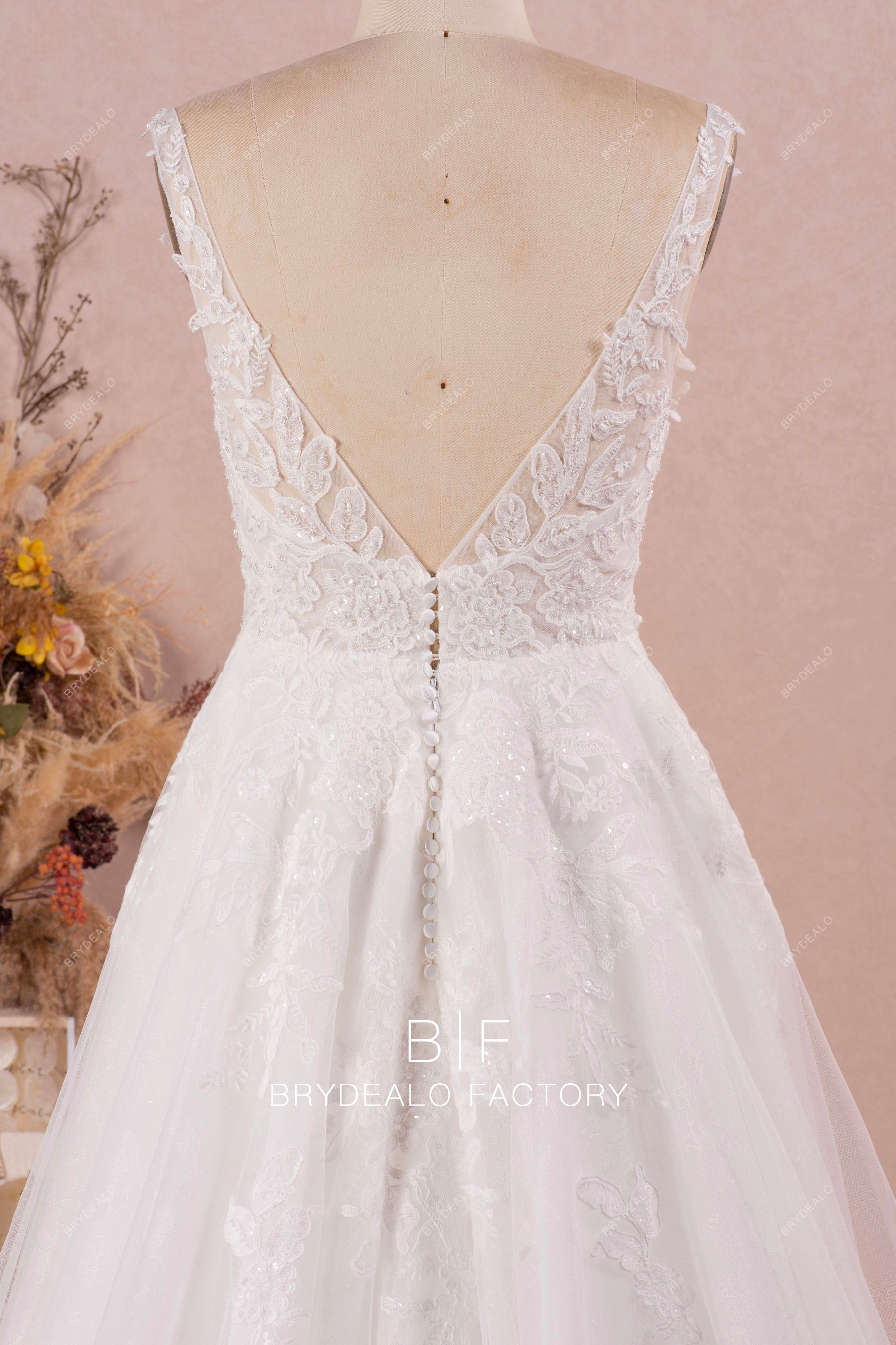 white shoulder straps buttoned back wedding dress