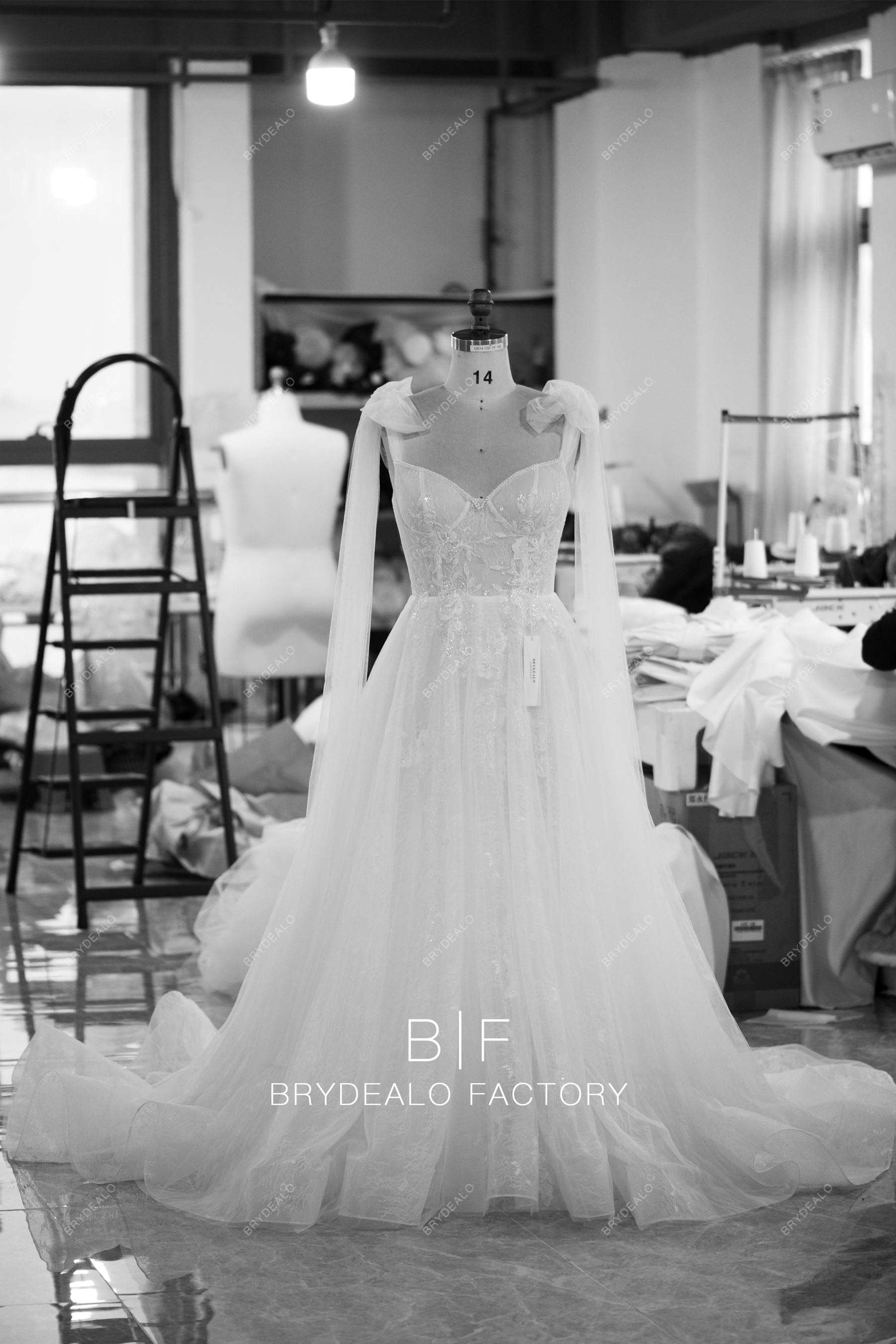 designer ruffled A-line corset lace wedding dress