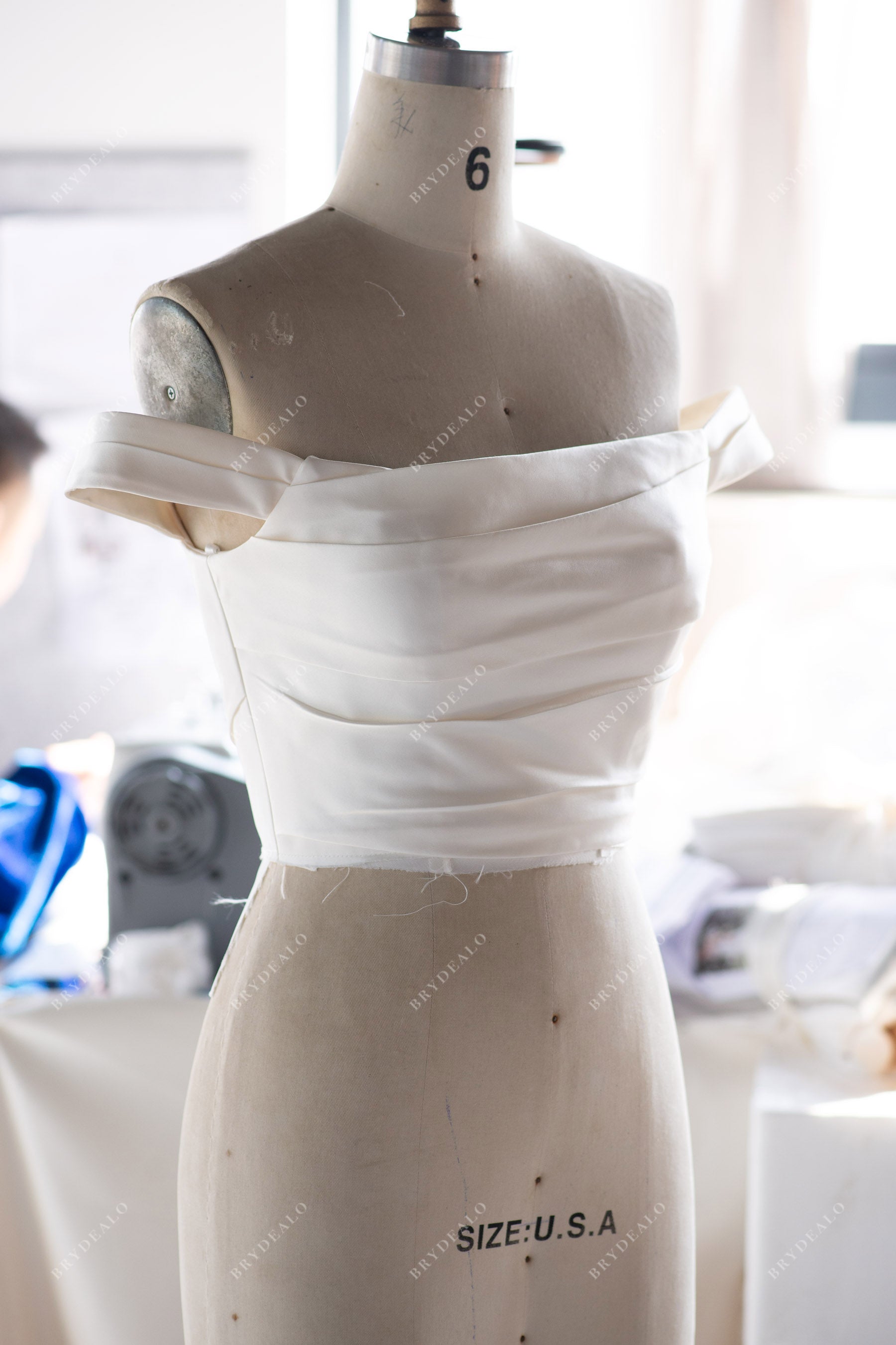 designer satin off-shoulder wedding dress
