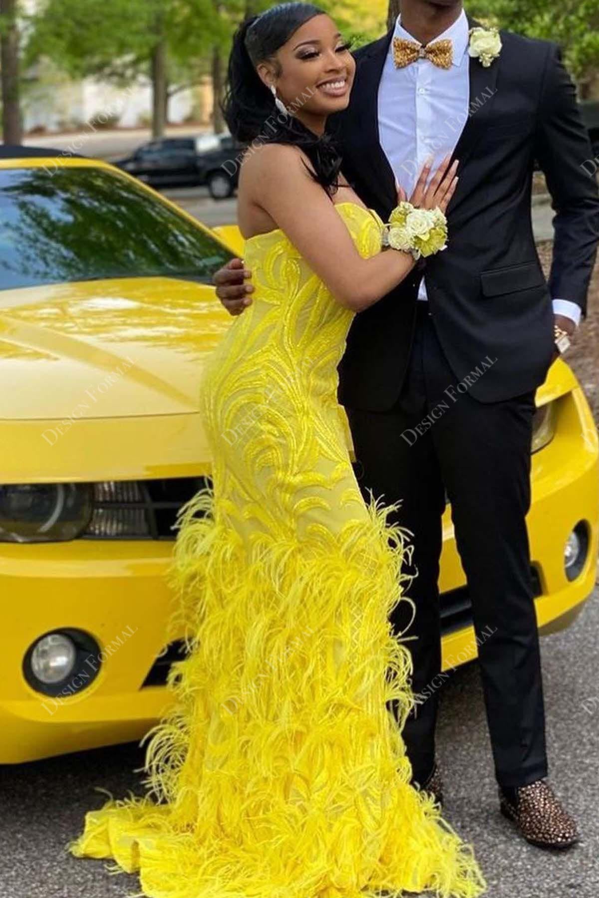 yellow sequin strapless feathered mermaid prom gown